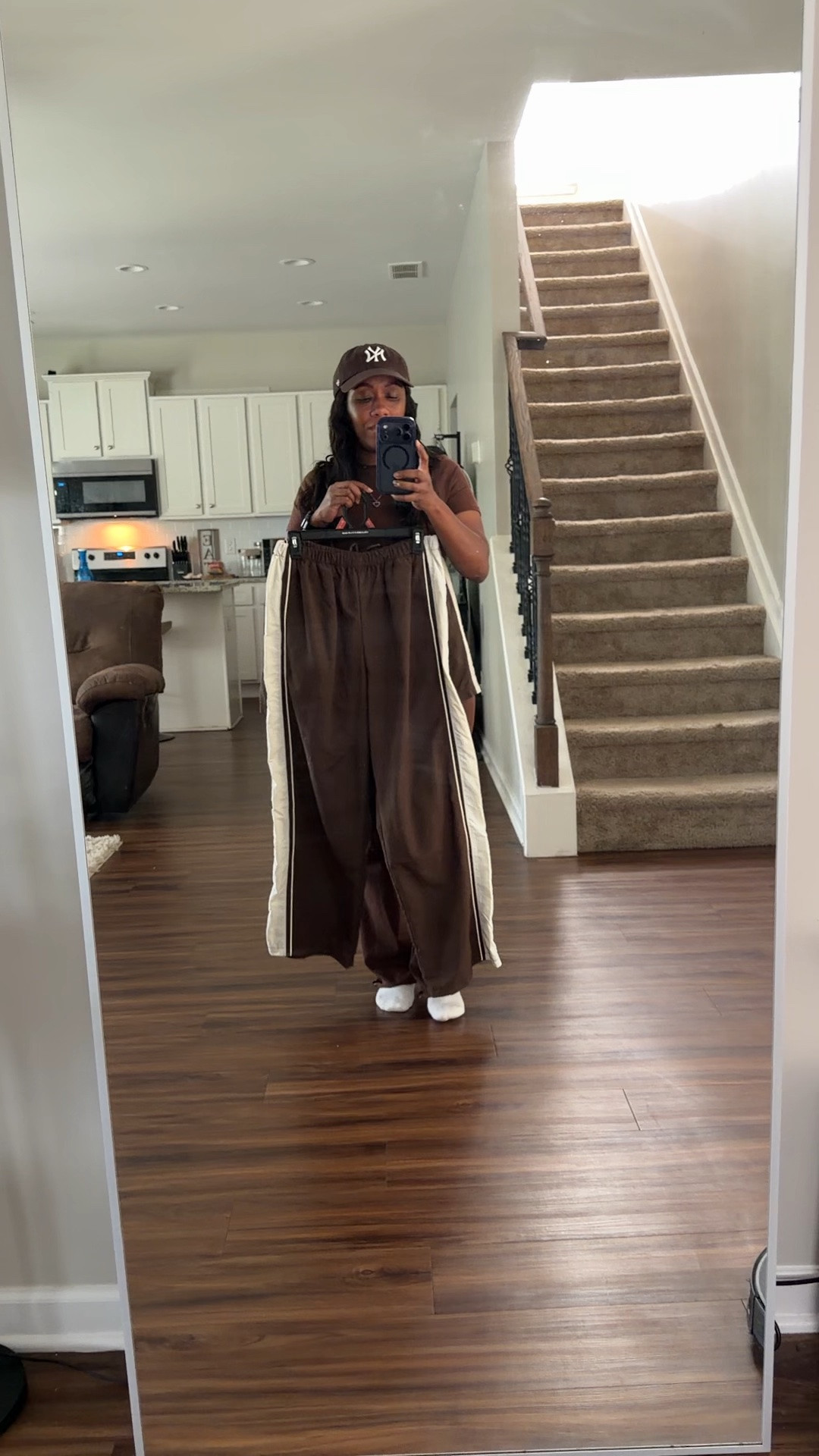 Brown track pants and brown nylon shorts

#LTKOver40 #LTKPetite #LTKootd
