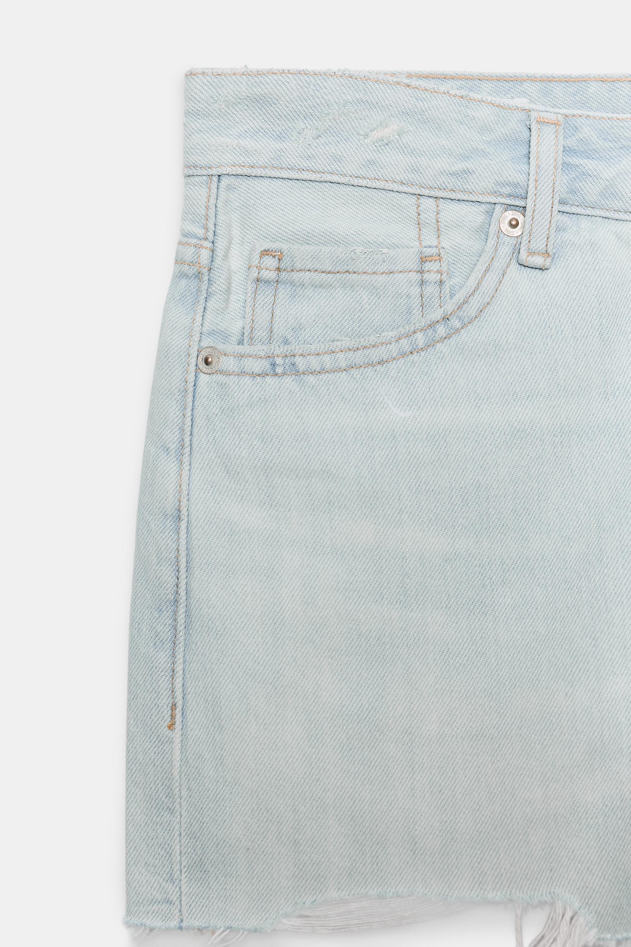 Mid-rise shorts with belt loops and five pockets. Featuring ripped detailing and seamless hems. Z... | Zara UK