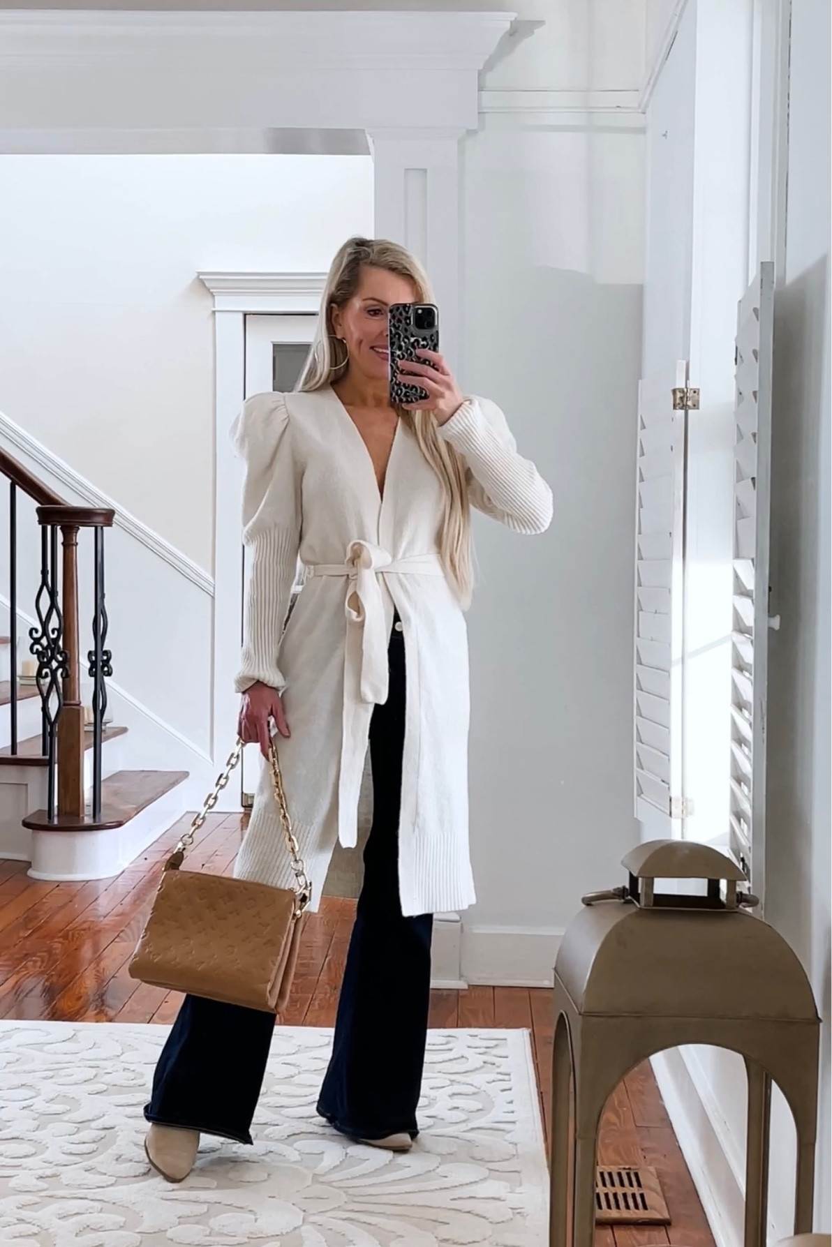 I have worn this statement puff sleeve cardi on repeat this season ! Perfect to dress up jeans or to style with dress pants for work ! 
Wearing : XS , currently 40 % off 

•
•

Flare leg jeans
Jeans 
petite jeans 
Long cardigan 
Neutral outfit 
Petite outfit 

#LTKFind #LTKworkwear #LTKSeasonal