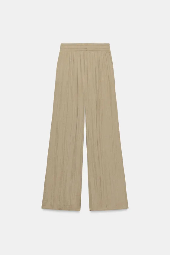 Model height: 177 cmHigh-waist trousers with an elastic waistband and front pockets. Featuring a ... | Zara UK