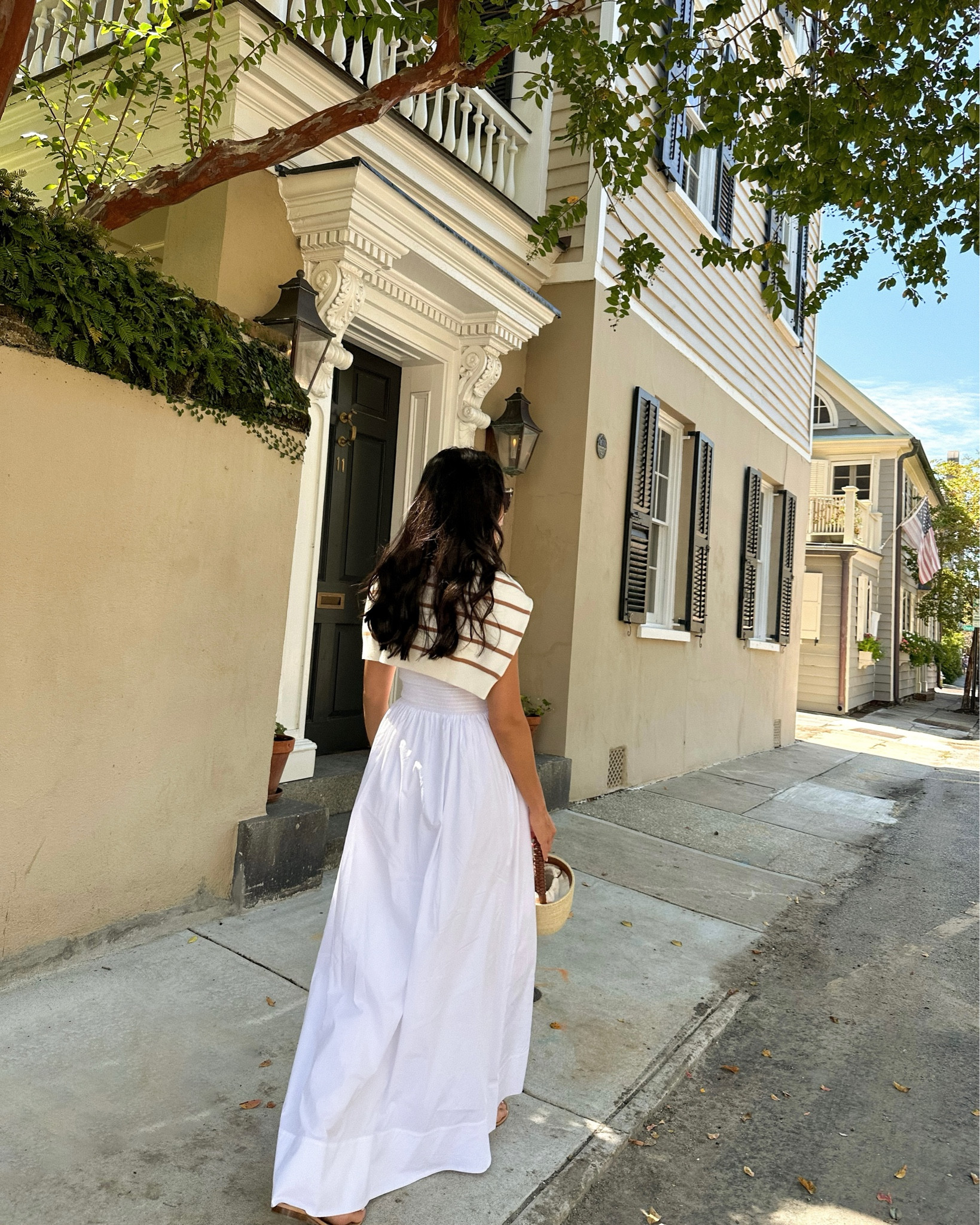 Kat Jamieson wears a white dress and stripe sweater in Charleston. Classic style. 

#LTKitbag #LTKtravel #LTKSeasonal