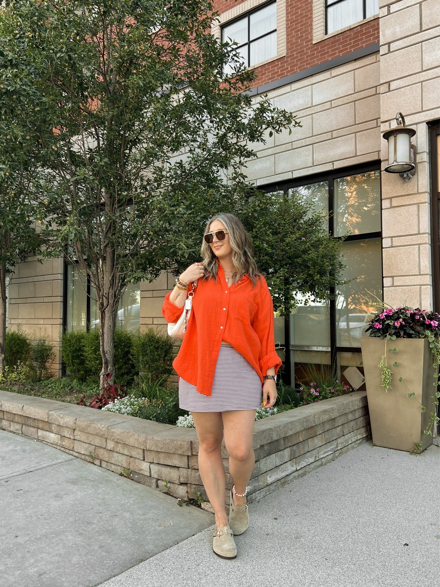 Easy summer outfit! Wearing my usual size L in both the red orange shirt and striped mini skirt (has built in shorts!). Birkenstock Bostons are super comfy, I’m a 9.5-10 shoe and wear size 40

#LTKsummer #LTKsale #LTKmidsize