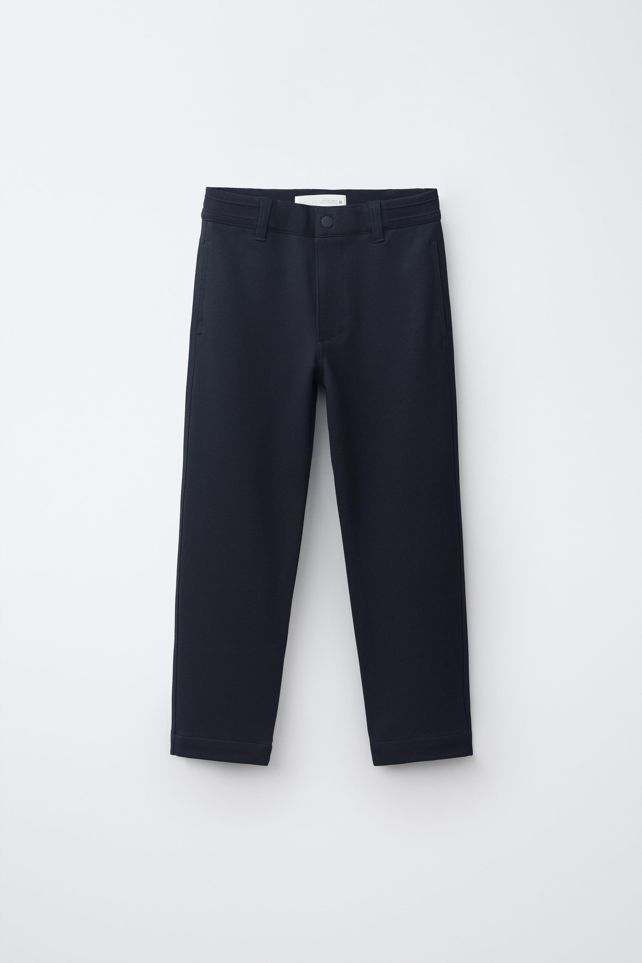 Straight-leg pants with an elastic ribbed waistband and front button closure. Features front pock... | Zara US