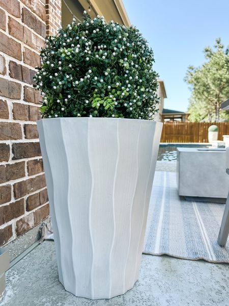 Walmart white planter with an Amazon faux topiary with the cutest white berries. Live this look if you don’t want to upkeep shrubs or plants. 

#LTKhome #LTKSeasonal #LTKstyletip