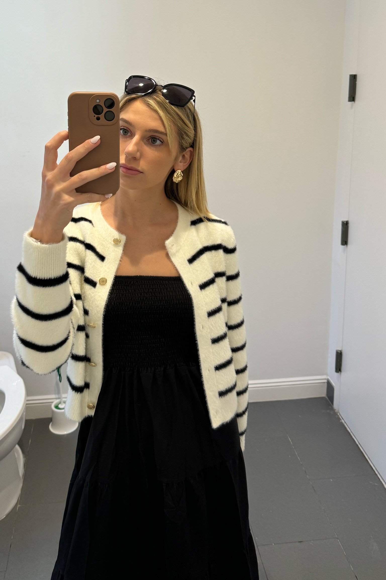 work outfit of the day 💄🍒

black sundress paired with a striped cardigan with gold buttons. gold earrings & black sunnies to finish off the look. 💖

#LTKstyletip #LTKworkwear #LTKfindsunder50