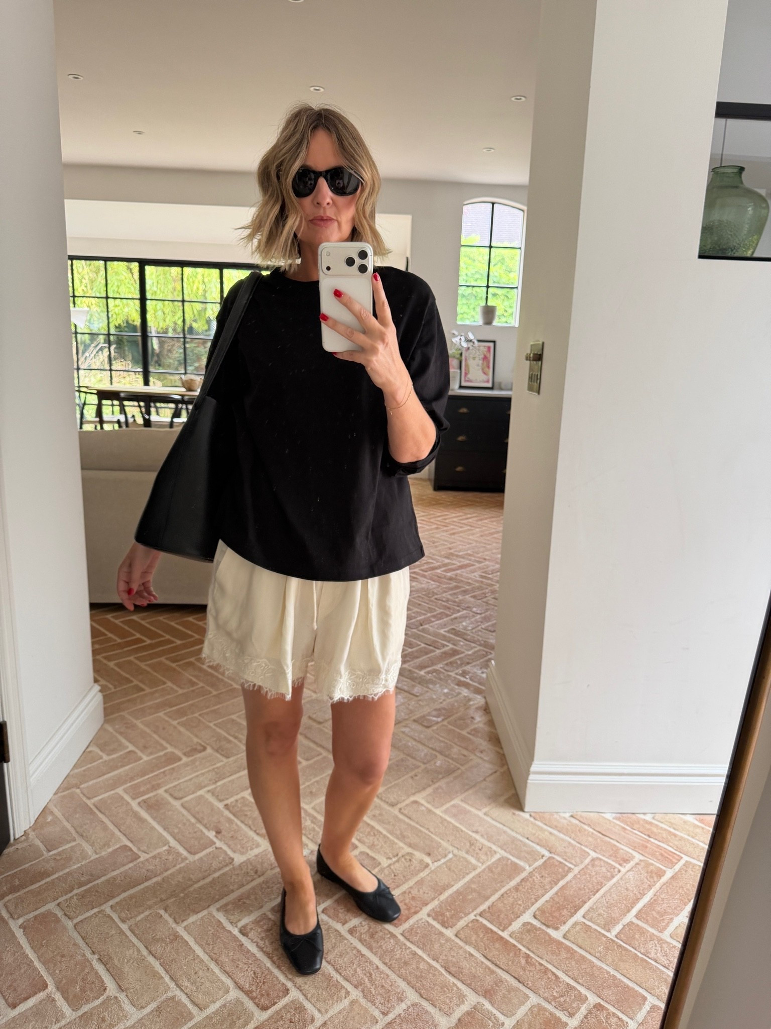 oversized black t shirt, boxy tee, black and cream outfit, cream lace shorts, lace trim shorts, satin shorts, black ballet flats, black leather tote bag, black cat eye sunglasses, gold bracelet stack, casual chic outfit, elevated casual, off duty style, weekend outfit, summer casual, effortless summer style, quiet luxury, elevated basics, neutral color palette, monochrome styling, mirror selfie ootd, ltkstyletip, ltkseasonal, ltksummer, ltkfindsunder100, ltkbeauty, ltkitbag

#LTKsummer #LTKeurope #LTKdatenight