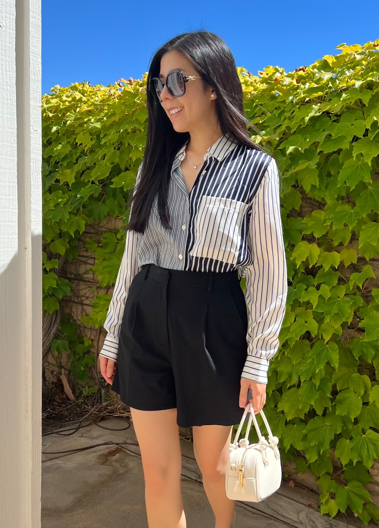 A collar button down and high waisted shorts combo never fails. This is my go to outfit formula that started during my Summer in Europe 2023 and is still going strong. For this look, I paired my mixed blue and white striped blouse with some pleated shorts and a minimalistic white bag for a casual day out. Have a wonderful weekend! 

#preppy #oldmoney

#LTKPetite #LTKItBag #LTKStyleTip