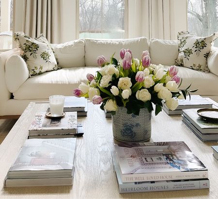Coffee table styling, coffee table decor - blue and white planter, design books, floral pillows, white couches 

Our coffee table is the French Contemporary collection from RH! 

#LTKSeasonal #LTKhome