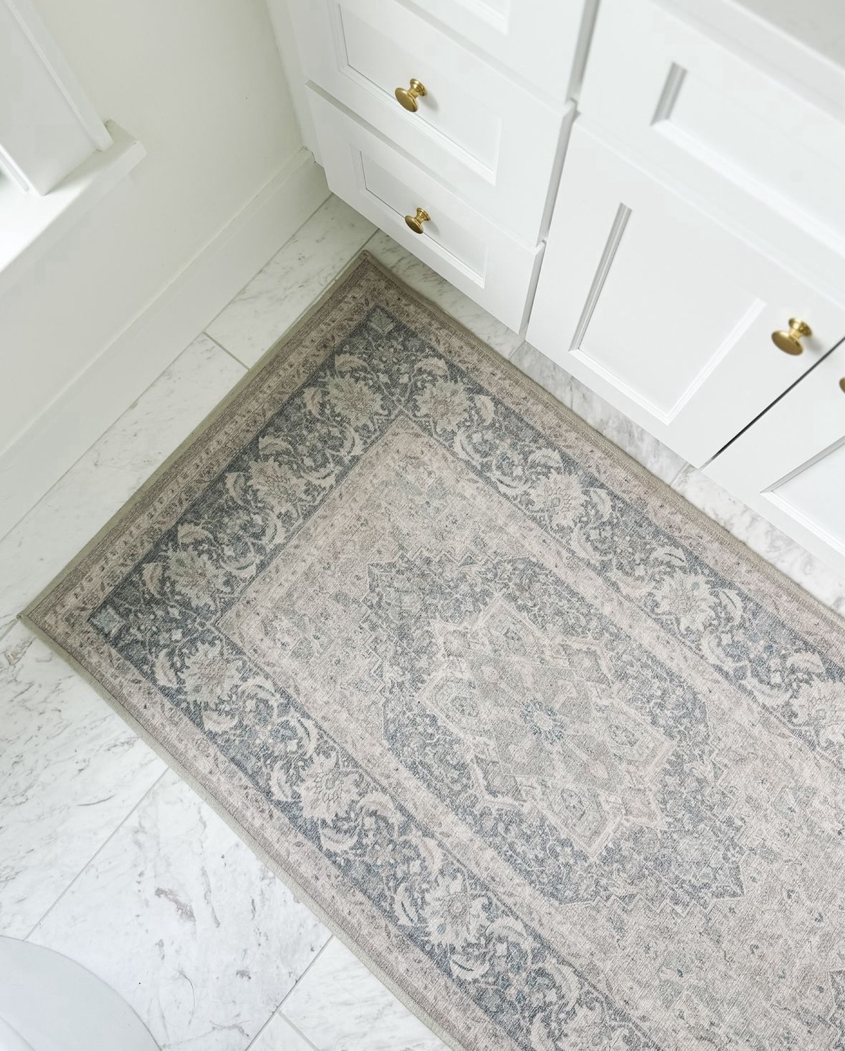 Shop my classic white bathroom design. I love the classic marble mixed with the soaking tub and mixed metal mirror and plumbing finishes. My bathroom runner is washable and perfect in the kitchen too.

#LTKHome #LTKStyleTip #LTKSaleAlert