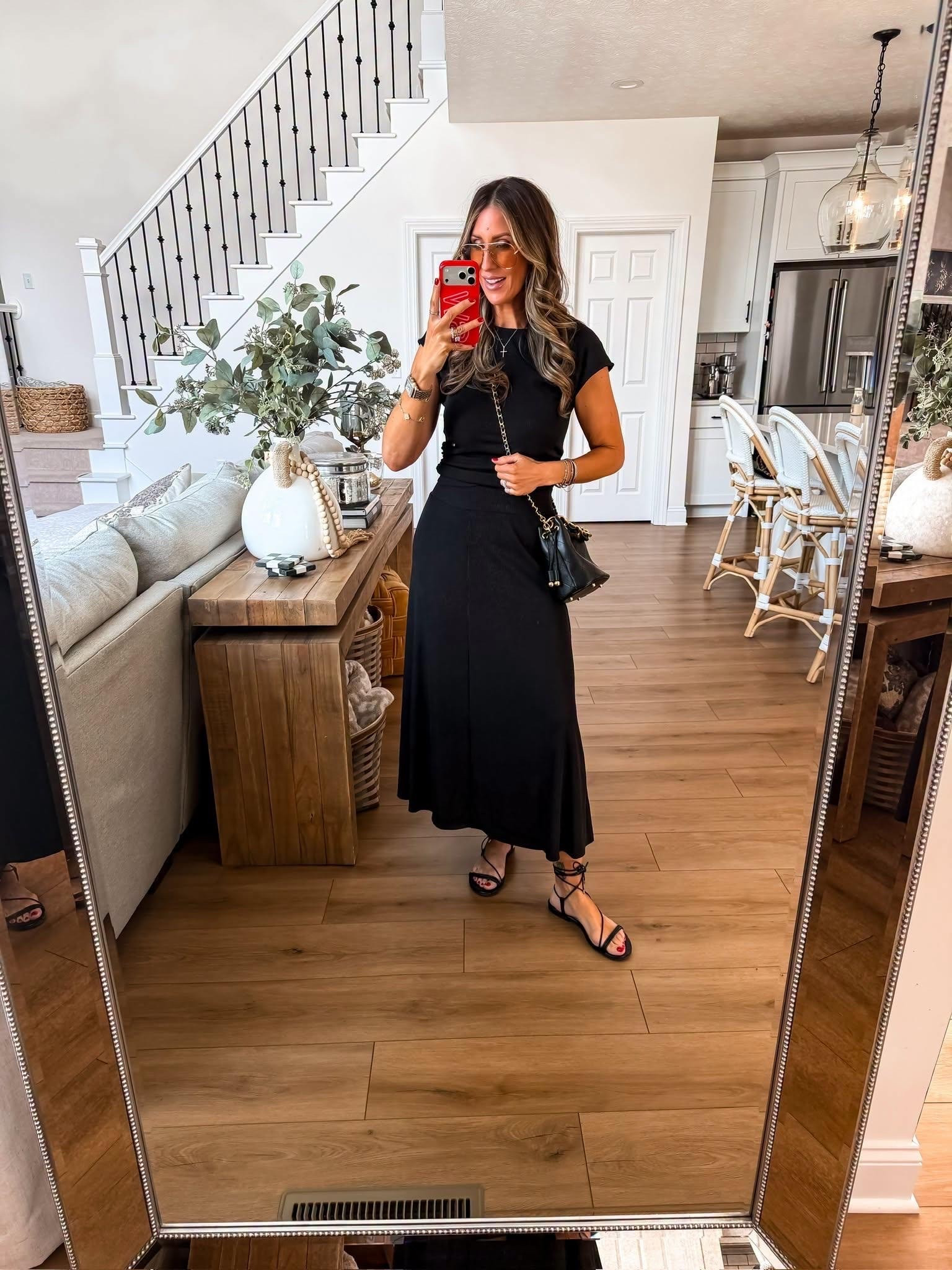 I love a matching set that looks this put together with almost no effort. The knit top has a clean, elevated shape while the coordinating skirt drapes beautifully without clinging, making it just as perfect for dinner out as it is for vacation or date night. Wear the pieces together for a sleek look or style them separately to get even more outfits out of your closet.

matching set, black two piece set, knit top, midi skirt, vacation outfit, date night outfit, elevated casual style, monochromatic outfit, travel outfit, capsule wardrobe, versatile fashion, TheMomInStyle

#LTKootd #LTKOver40 #LTKTravel