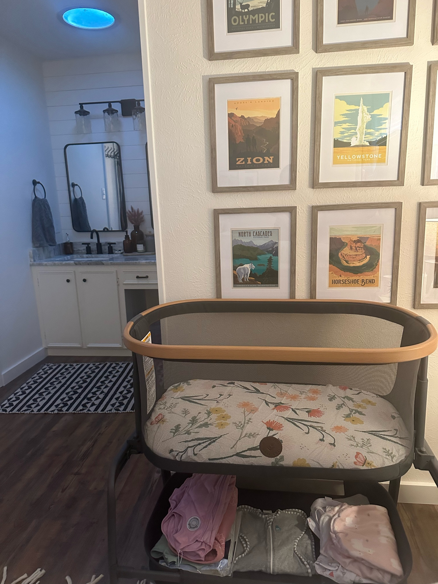 Our bedside setup for baby girl🤍 Maxi-Cosi bedside bassinet with the cutest sheet & all of her sleep sacks/ swaddles underneath  

#LTKhome #LTKfamily #LTKbaby