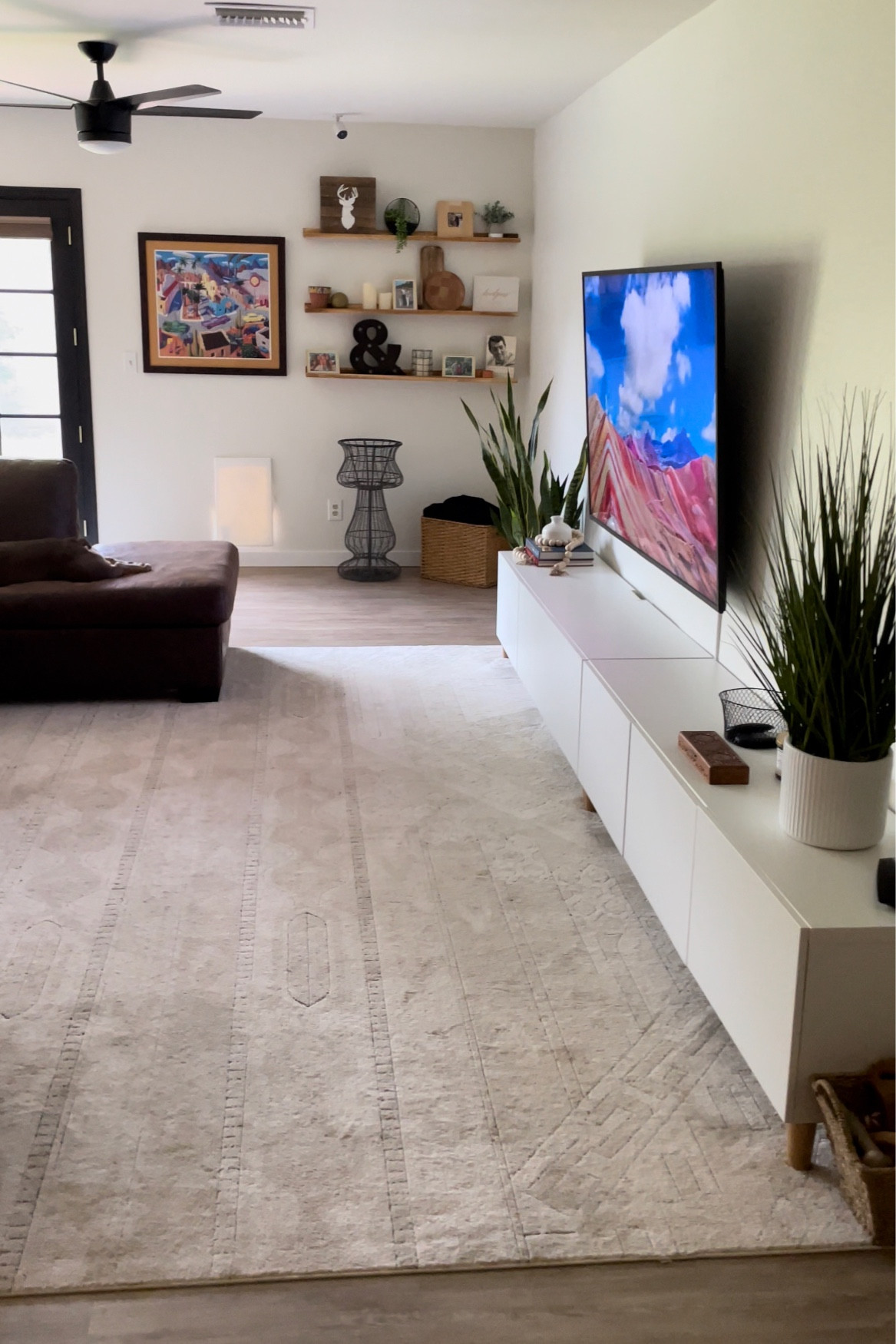 Family room details! ✨ 10x13 neutral family room rug! My tv console is actually 2 pushed together with legs I found on Amazon! The styled wood shelves I also found on Amazon as well! 

#LTKfamily #LTKhome