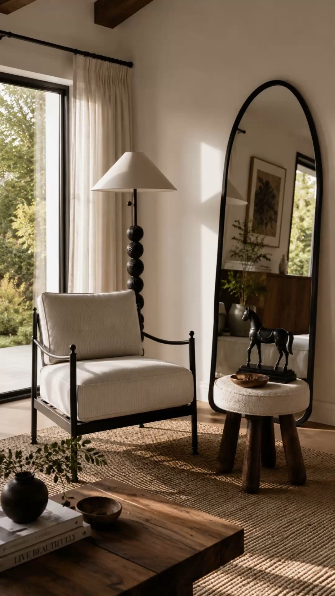 This corner feels like something straight out of a boutique hotel and I can’t get over it 🤎

The oversized mirror, sculptural lamp, textured accent chair, and dark wood tones balance each other so well while still keeping the space warm and inviting. Cozy, elevated, and lived-in is always the goal.

#livingroomdecor #modernhomeideas #cozyminimalhome

#LTKHome #LTKSaleAlert #LTKSeasonal
