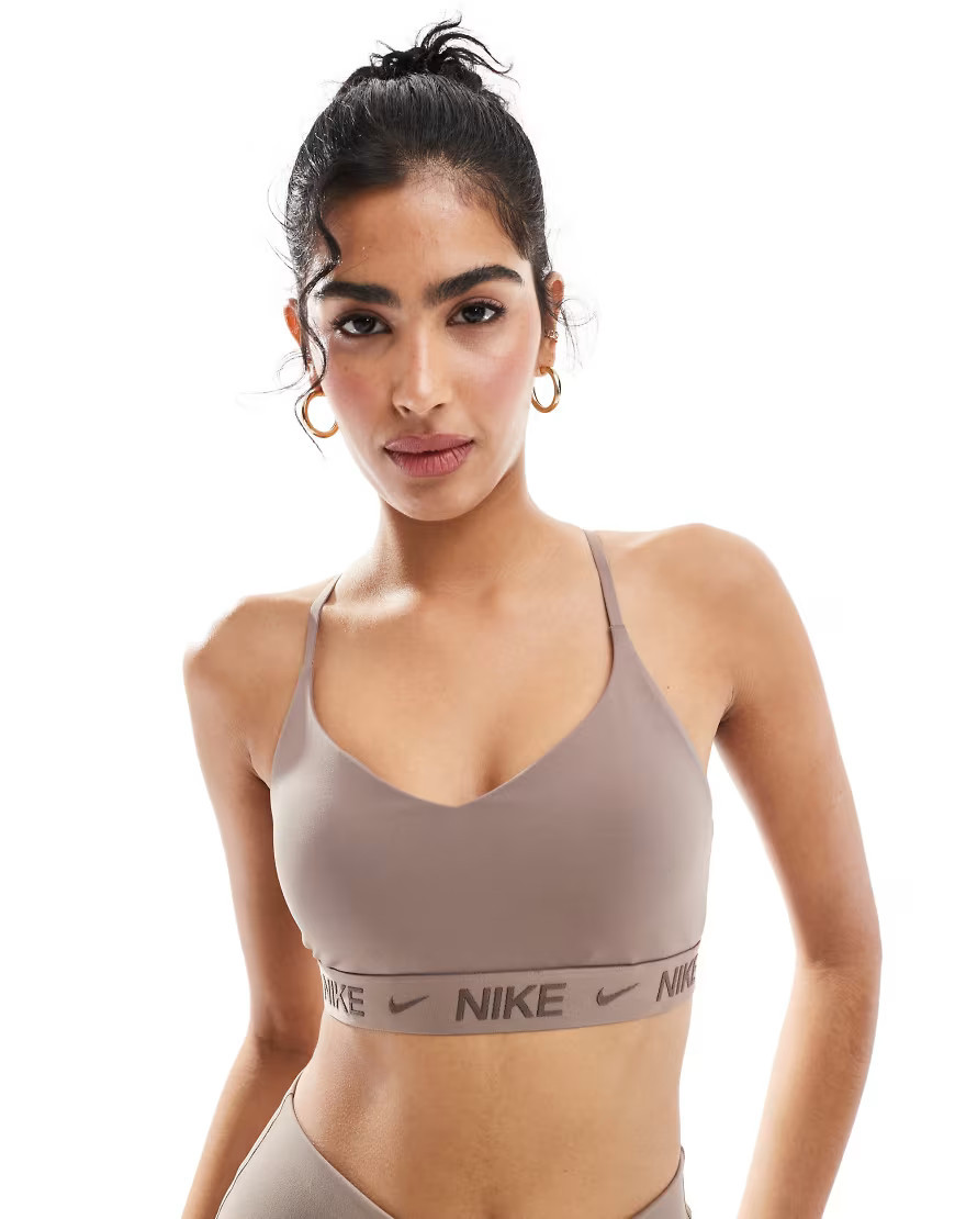 Nike Training Indy light support sports bra in brown | ASOS (Global)