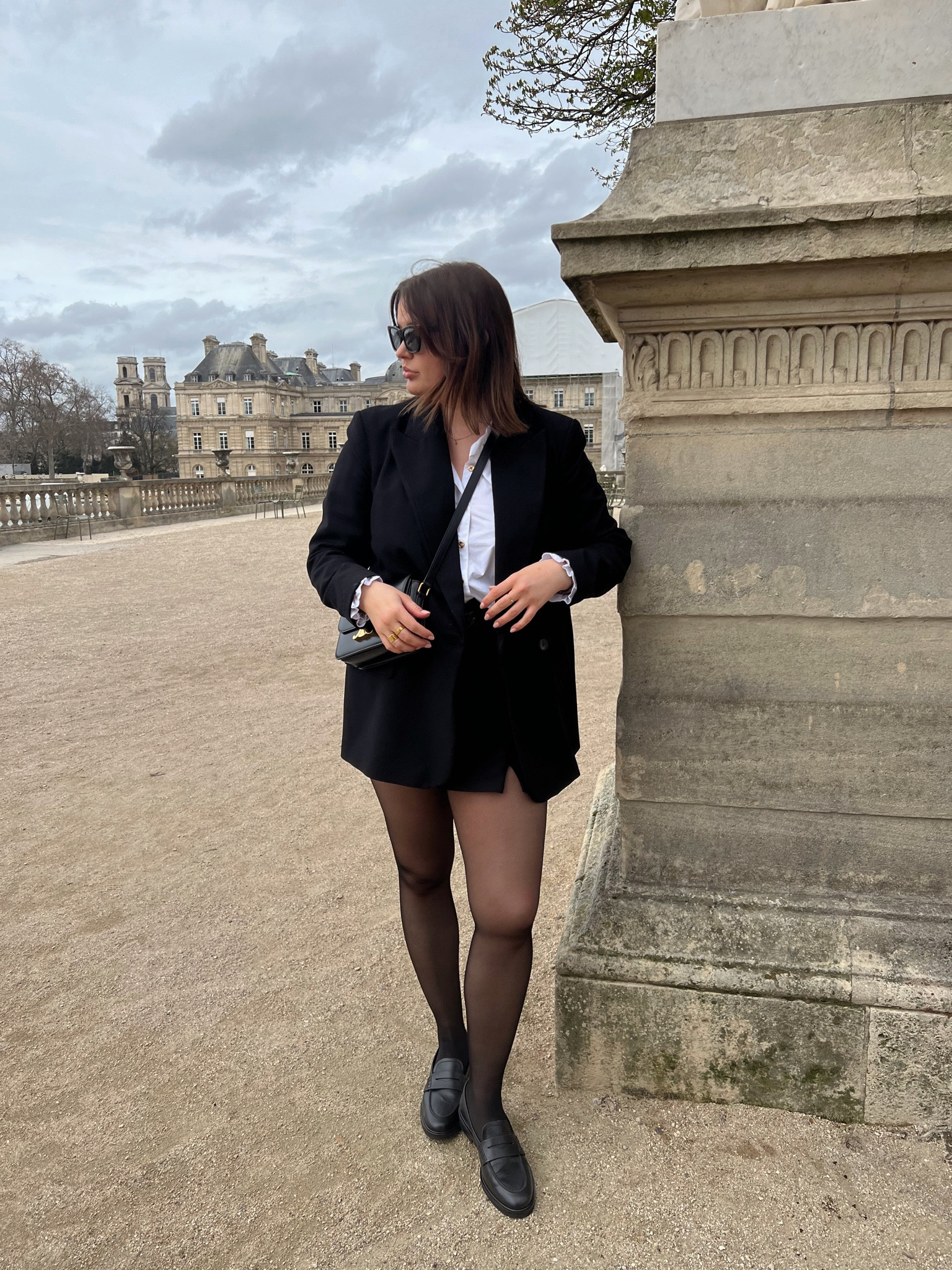 Black & white preppy spring outfit in Paris - H&M black sheer tights, black river island blazer, black tailored shorts, flattered black penny loafers, Celine teen triomphe bag, lk bennett white ruffle shirt, Céline sunglasses  

#LTKstyletip #LTKSeasonal #LTKeurope