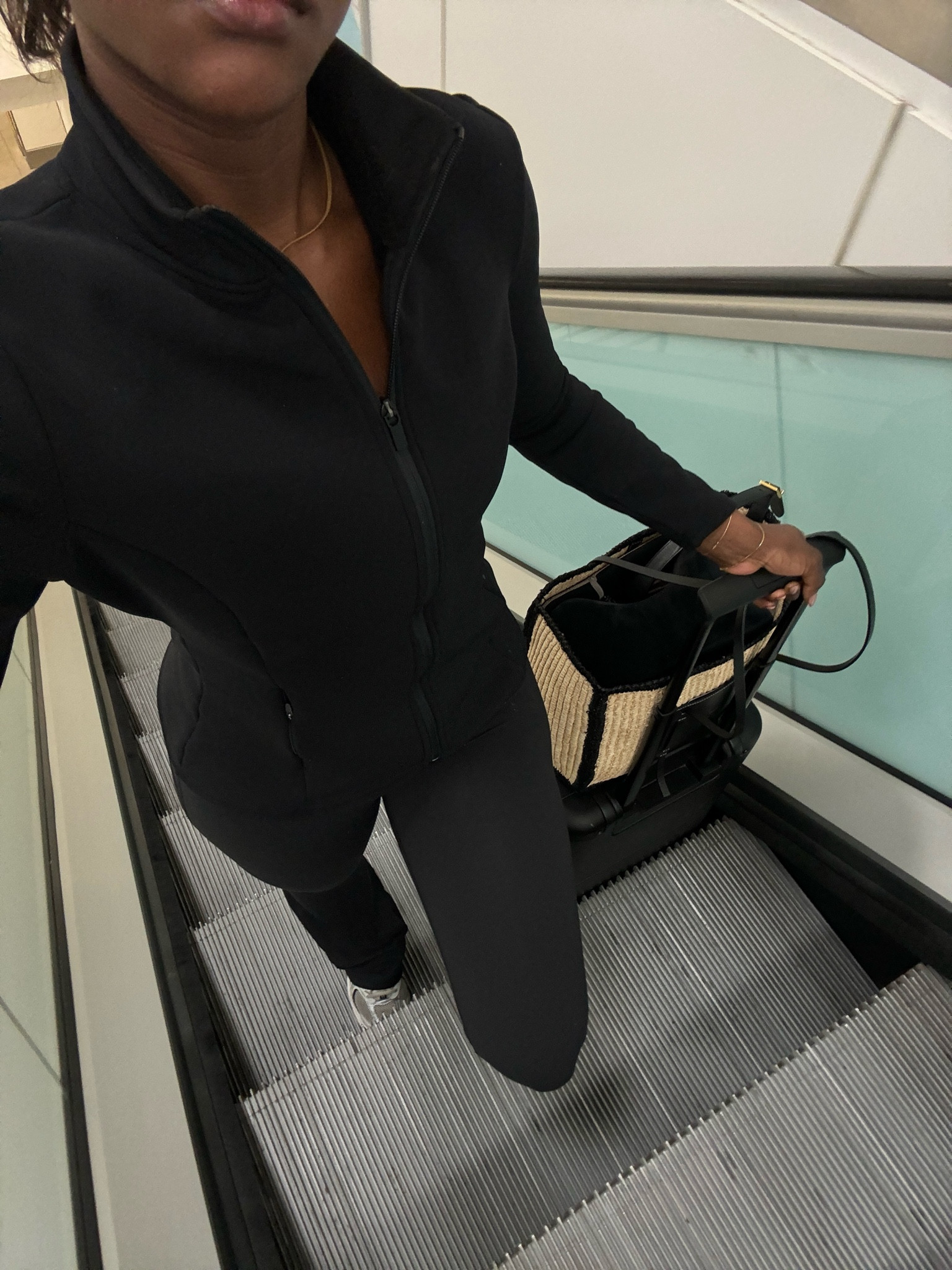 Airport outfit, zip up jacket, tala, new balance trainers, flared trousers, DeMellier bag, travel outfit 

#LTKuk #LTKsummer #LTKstyletip