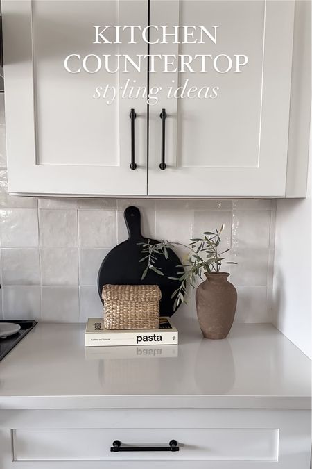 Kitchen counter styling items 

Rattan box: IKEA
Vase: DIY (tutorial on my page!) 
Stem: fresh olive branch 
Wood serving board: Cole & Mason 

#LTKhome
