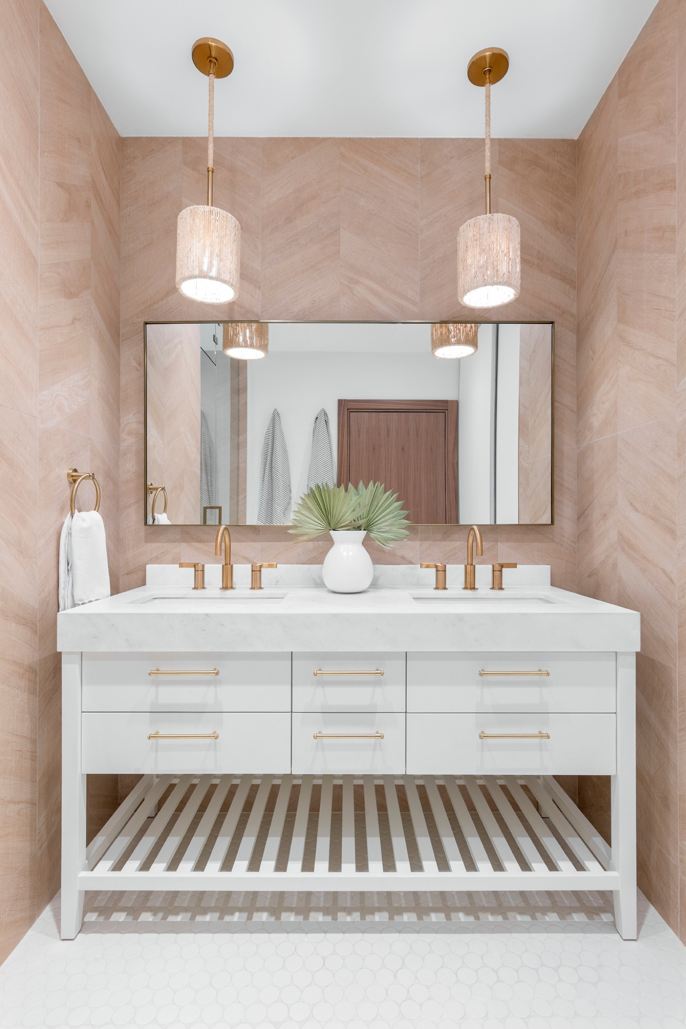 This partial gut renovation was tailored for a dynamic family of four. Each space was meticulously crafted to reflect the eclectic taste of its owners. Explore the unique features that define this home's vibrant personality.

Chevron-chic in the primary bathroom, where luxury meets simplicity for a family on the go. Warm porcelain chevron tiles, beautiful brass hardware, and natural fiber pendants create a touch of chic elegance, resonating with a family that values the beauty of life's simple pleasures.

#LTKhome #LTKfamily #LTKMostLoved