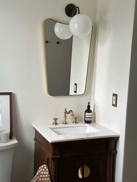 Main bathroom links ~

Organic modern bathroom, dark wood vanity, butterfly brass mirror, modern vanity light 

#LTKFind #LTKhome