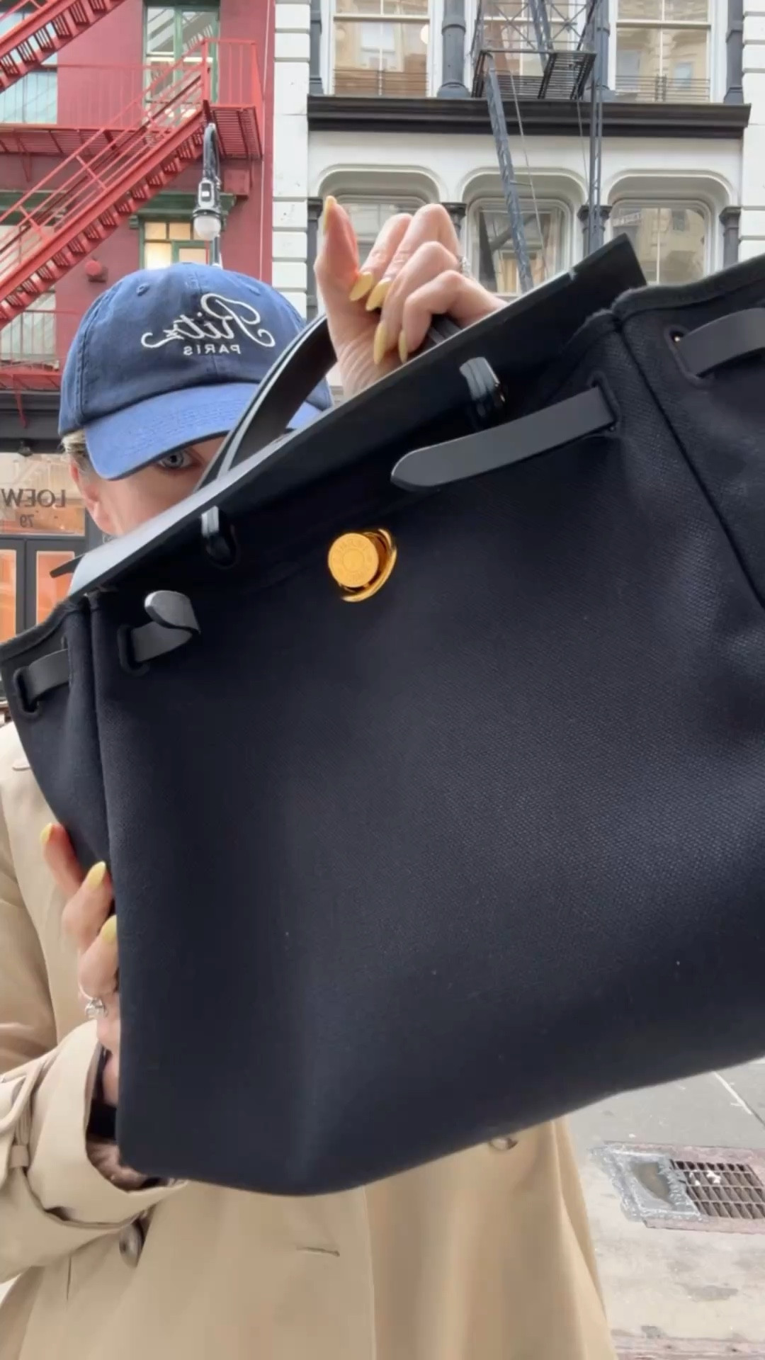 Trench coats and her bags for spring 