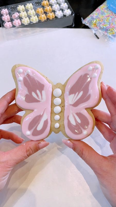 Springtime makes my heart flutter 🦋 Tried some new Easter Sugar Cookie designs this weekend with my favorite pastel colors. See icing + sugar cookie recipe below! The Butterfly was inspired by @southstreetcookies who is an incredible cookie baker (and also from Iowa 💗)

ICING / FROSTING RECIPE:

Beat:
3 TBSP Meringue Powder
1/3 cup to 1/2 cup Warm Water (Until frothy)

Add:
4 Cups Powdered Sugar (Slowly until glossy)

Add:
Vanilla to taste and more water if the icing is too stiff.
This dries pretty fast (within 5-10 minutes)

MY GRANDMA BETTY’S SUGAR COOKIE RECIPE:

1 Cup Soft Butter
11/2 Cups Sugar
2 Eggs
1 Cup Sour Cream
11/2 TSP Vanilla
41/2 Cups Flour
1 TSP Salt
1 TSP Baking Soda
1/2 TSP Nutmeg

Cream butter and sugar till fluffy, add eggs and beat well. Add sour cream and vanilla, blend well. Add dry ingredients. The dough will get quite soft. Chill for several hours or over night. Roll to 1/4 inch thickness, cut, (sprinkle with sugar if you don’t plan to frost), and bake at 375 for 8-12 minutes just until some edges get barely golden. Undercooked is better than overcooked!

#easterrecipe #eastercookies #eastersugarcookies #sugarcookies #sugarcookiesofinstagram #sugarcookiedecorating #royalicingcookies #royalicing 

#LTKhome #LTKSeasonal #LTKparties