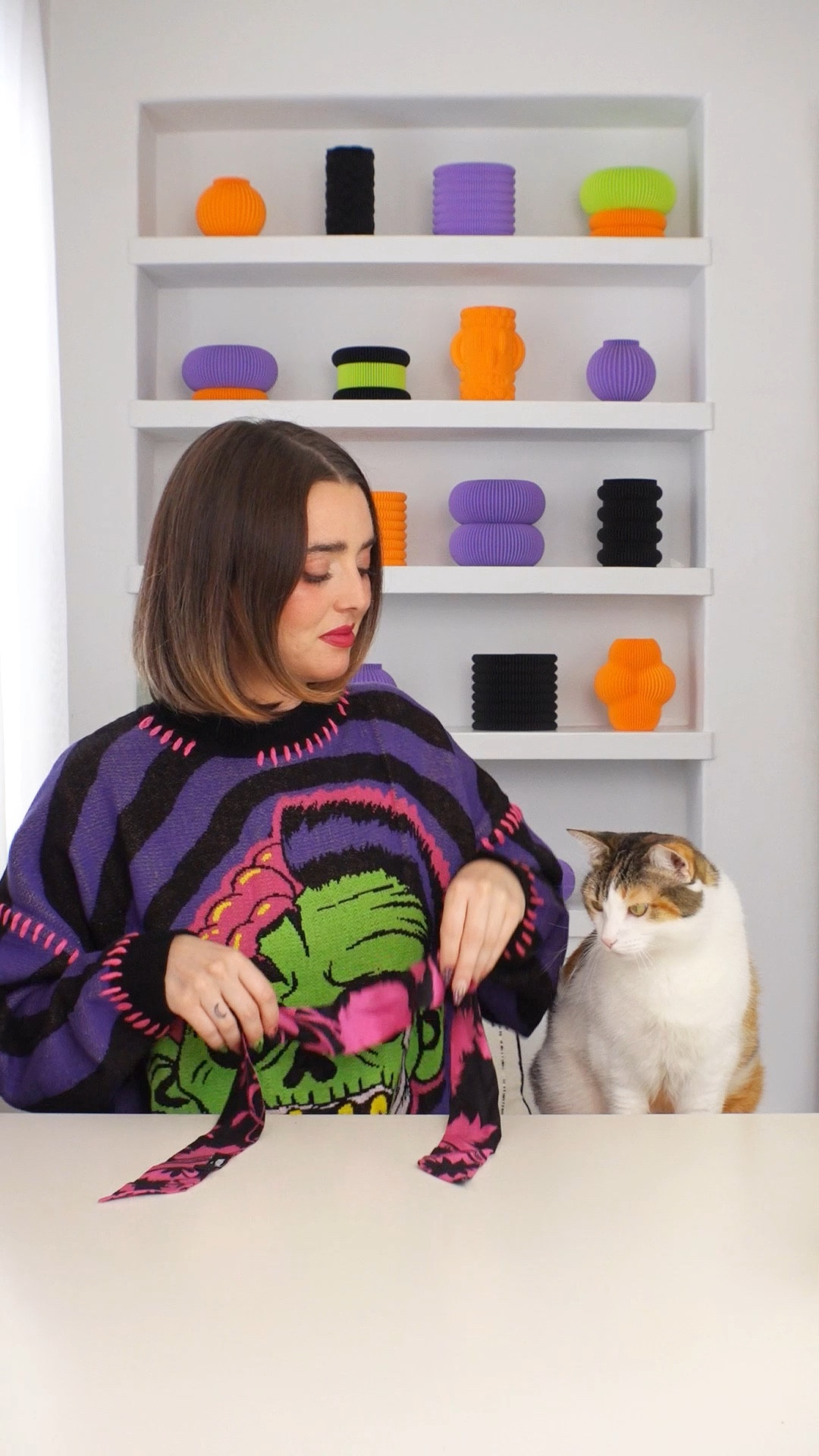 a very kitschy Halloween 🎃✨

Champagne wears a knitted purple black and green zombie sweater with rhinestone diamond necklace from Betsey Johnson in the shape of hands, and hand rhinestone dangle earrings. Pony wears a pink and black Versace scarf tie with Halloween themed necklace. Champagne and pony wear matching orange heart shaped sunglasses.
#asmr #jewelry #jewellery #grwm #cat #cats #ootd #catlover #catlife #dopaminedressing #halloween #spooky #spookyseason #maximalist #maximalism 

#LTKSeasonal #LTKHalloween #LTKHoliday