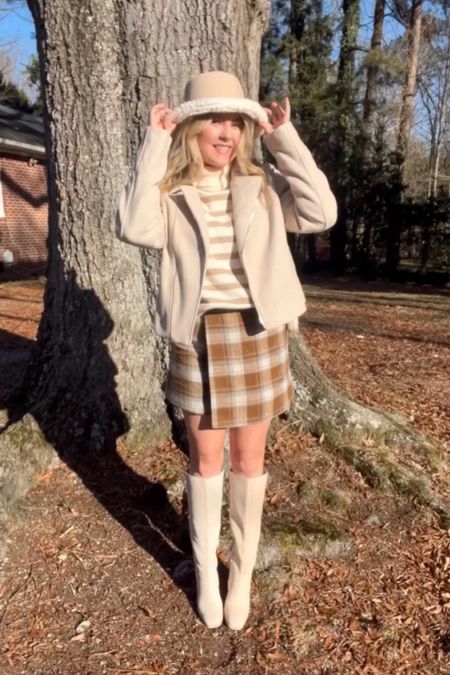 Cute and cozy winter outfit with white knee-high boots, app, plaid skirt and adorable striped sweater 

#LTKMostLoved #LTKshoecrush #LTKfindsunder100