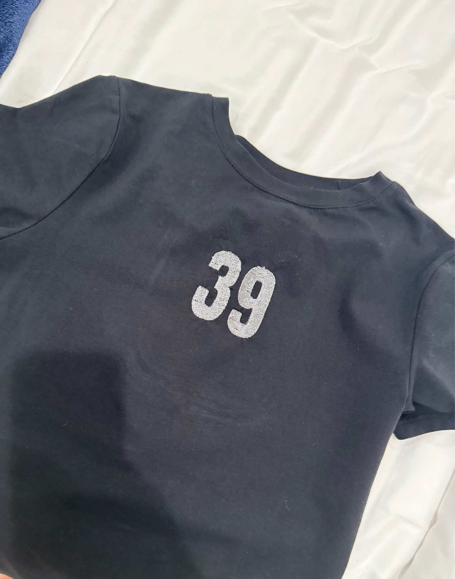 Fun embroidery project for my next game day outfit!!!!!!! 
Gotta love baseball season and my #39 ❤️🤟🏼 this is the best top with or without the embroidery and it’s only $10!!! 

#LTKfindsunder50 #LTKfitness #LTKstyletip