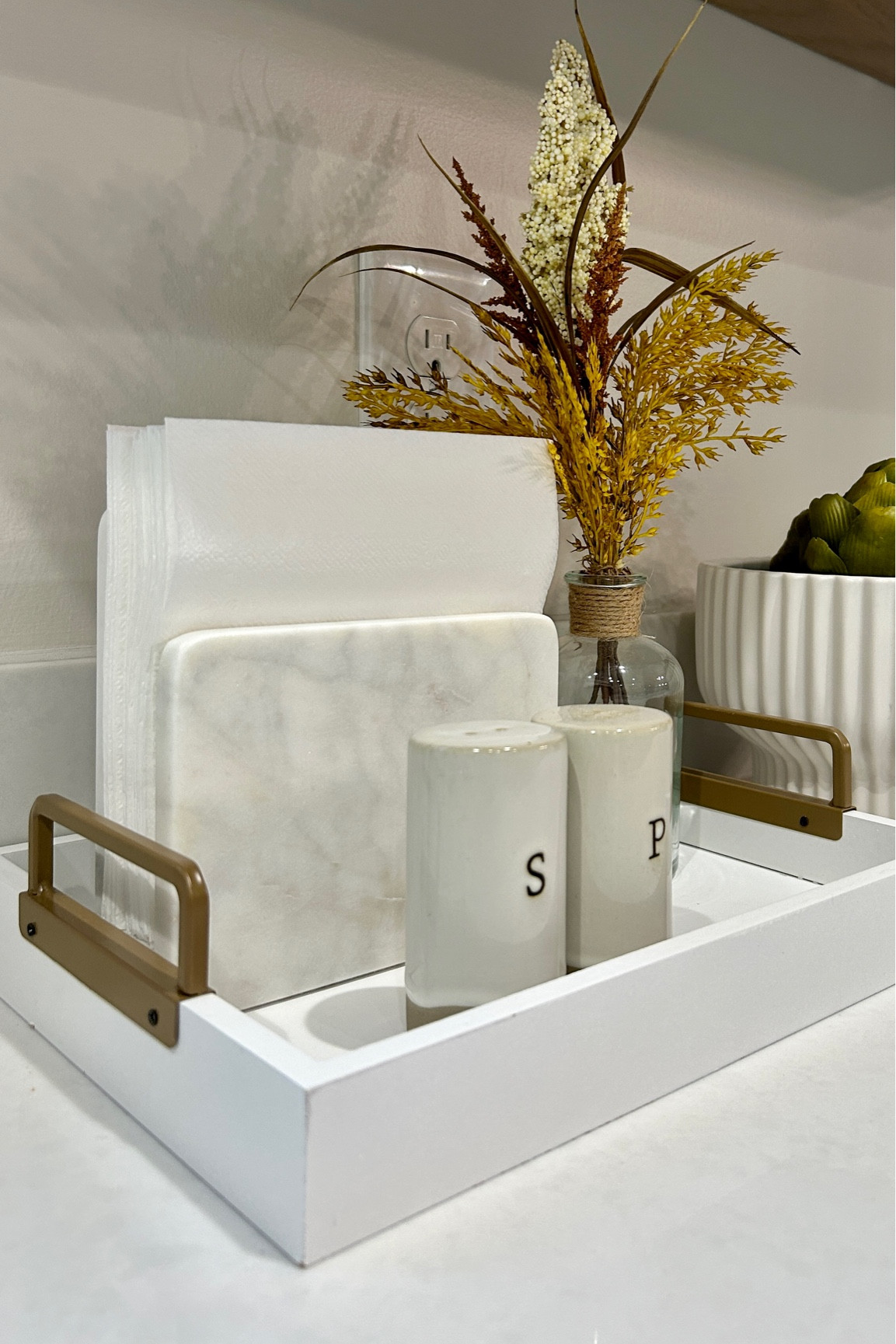 Fall kitchen countertop styling!
The tray is from the Target dollar spot! 

Napkin holder, salt and pepper shakers, tray styling, fall stems 

#LTKFind #LTKstyletip #LTKhome