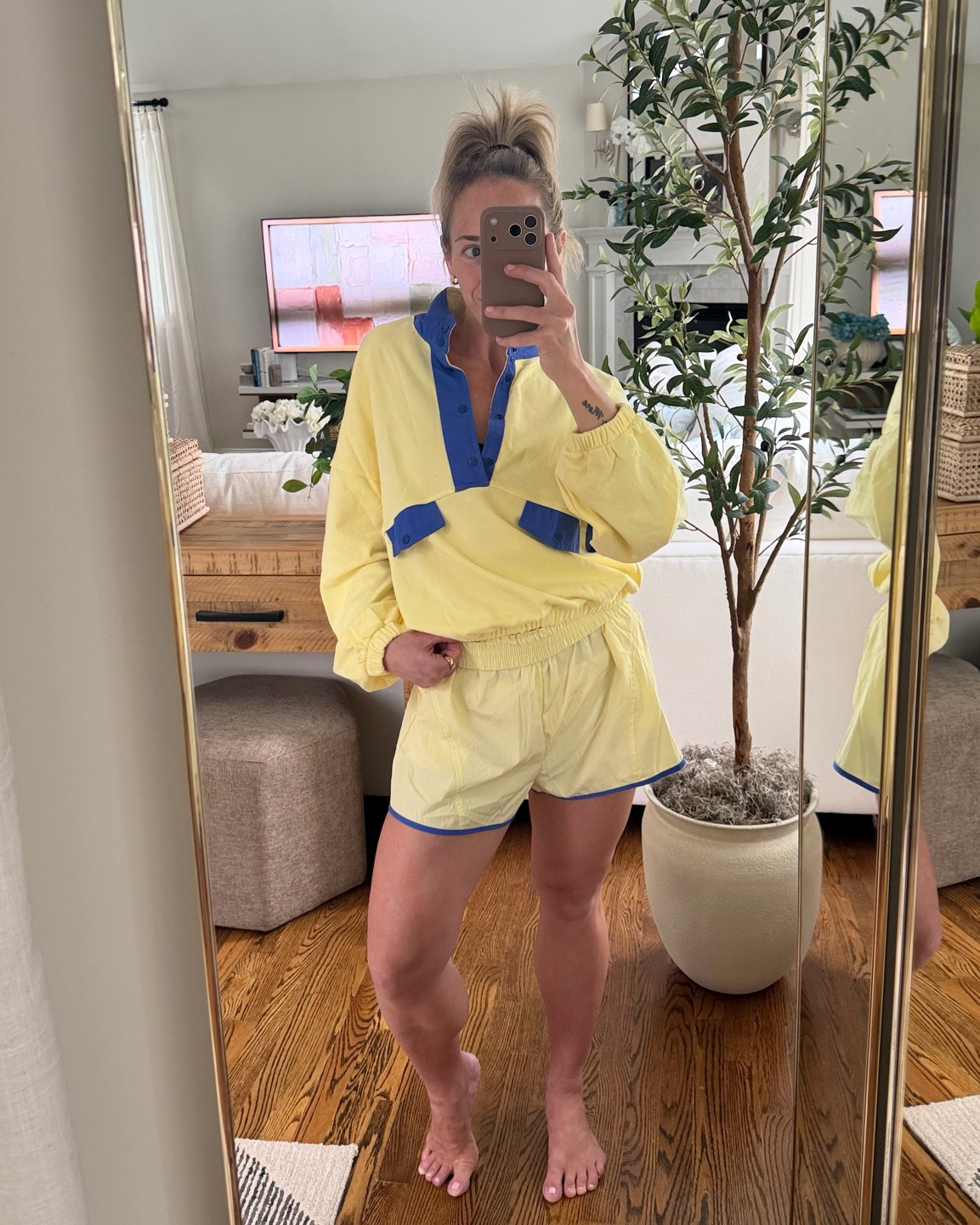 This adorable 2-piece set looks just like the Free People version… but this one is just $19.99 !! 🤯

very cute casual matching set for women at an unbelievably low price!  A fantastic value!  🤸🏼‍♀️

swipe 👉🏻 for a video

Things To Note 💁🏼‍♀️
• both pieces run TTS
• the shorts are a swishy tracksuit/wind breaker type fabric, as is the blue trim on the sweatshirt.
• the shorts have no lining so if you’re gonna workout in them you’ll need to wear spandex shorts underneath 
• the yellow color shorts are a bit see-through (wear nude undies or black spandex shorts)
• the top is thick but lightweight (no fleece lining or anything). It has snap buttons and it made of a ribbed material.
• The top has a stretchy “bungee” bottom but no drawstring to tighten it (which is why i think my normal size small will fit me much better!)

overall it’s a super cute two-piece lounge set thats great for running errands, lounging, working out, and traveling!  (I intend to wear this matching set on the plane when I travel to Europe! ✈️)

SIZING:
* I suggest you get your normal size! 
I’m 5’4”, 120lbs, 32B & jeans size 26
    👉🏻 I accidentally sized up to a Medium and it’s too large on me- I need to return for a SMALL!

.
.
women’s outfits over 40
travel outfits
matching workout sets
two-piece loungewear
athleisure 
activewear for women
cozy matching set under $20!
fall outfits
summer outfit over 40
back to school outfits
free people dupe
free people inspired look

#LTKootd #LTKActive #LTKOver40