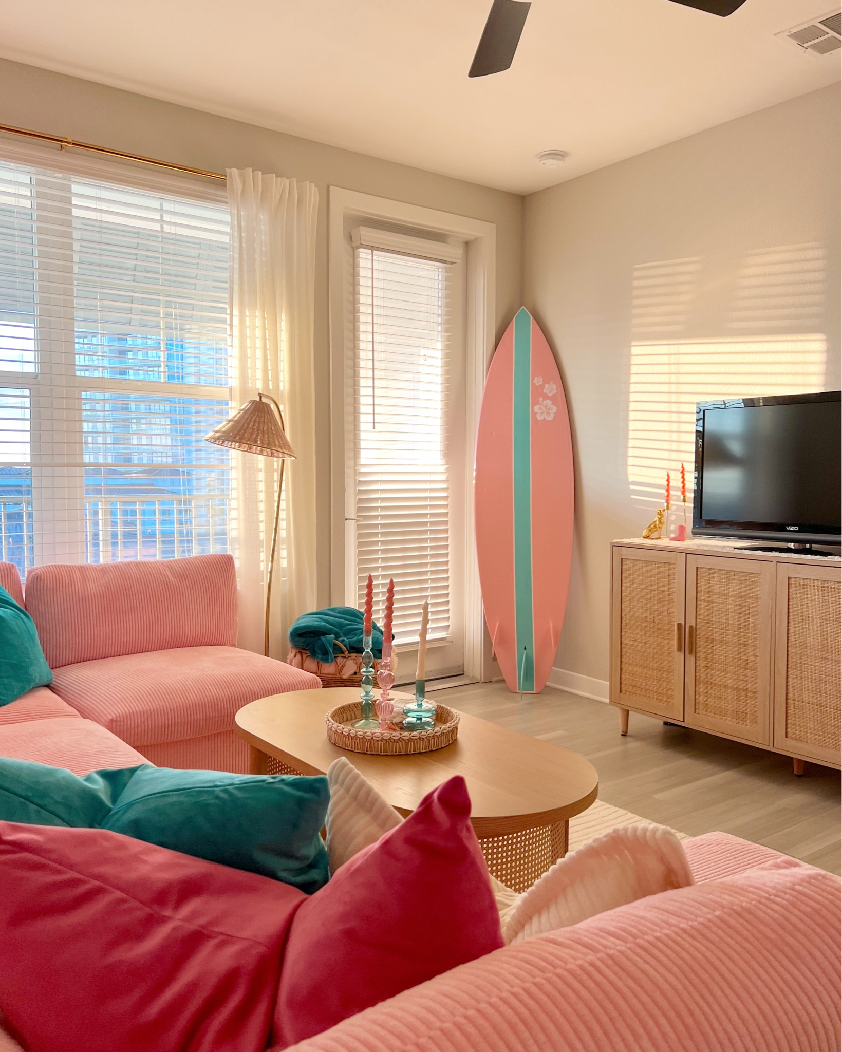 my brand new living room. love this pink couch. surf board was custom by my dad 🏡💗🏄‍♀️ 

#LTKHome