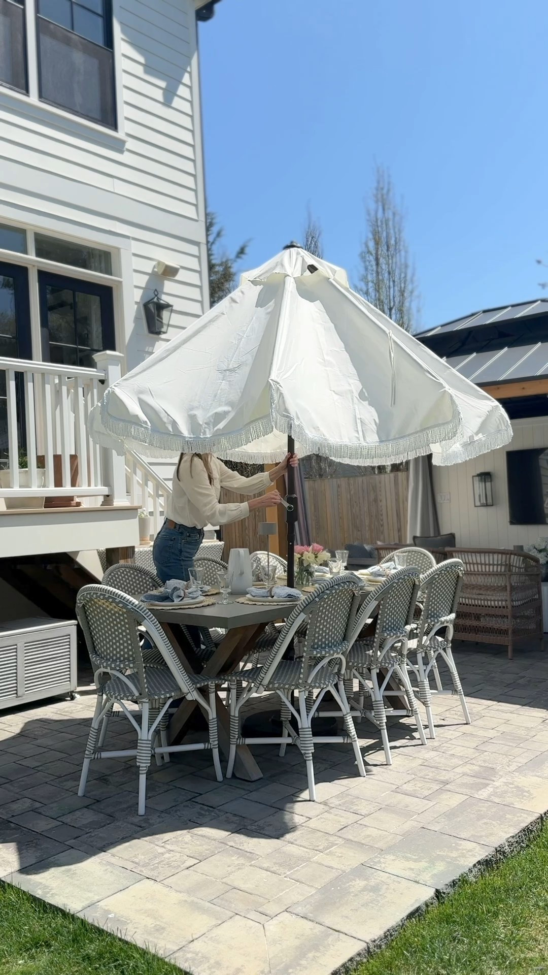 Absolutely obsessed with my new white fringe tassel patio umbrella. The large size gives it perfect coverage for shade during outdoor dining. The crank and tilt option are easy to use. 

#LTKStyleTip #LTKSaleAlert #LTKHome