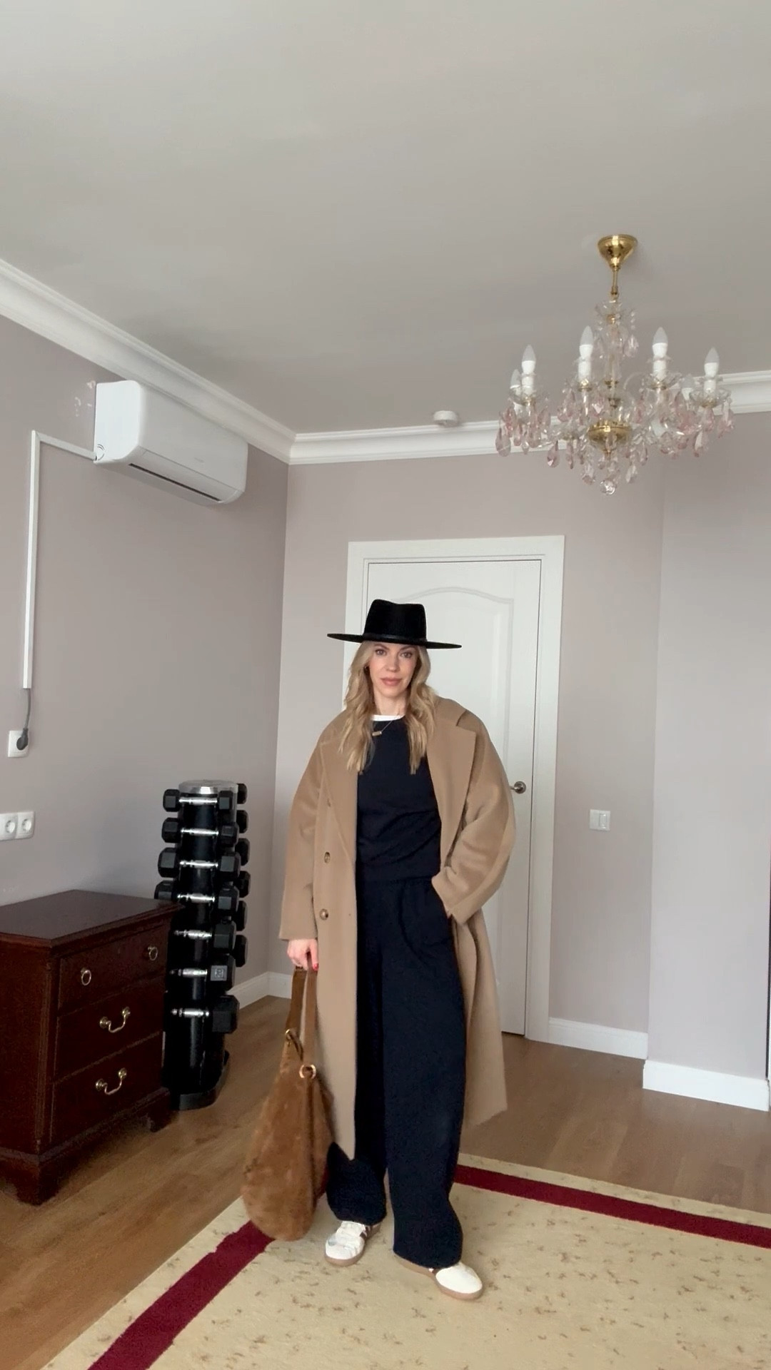 Chic travel look, airport outfit, @Zara navy blue sweat set, camel coat, @Janessa Leone black wool hat, YSL suede bucket bag

#LTKActive #LTKdayinmylife #LTKTravel