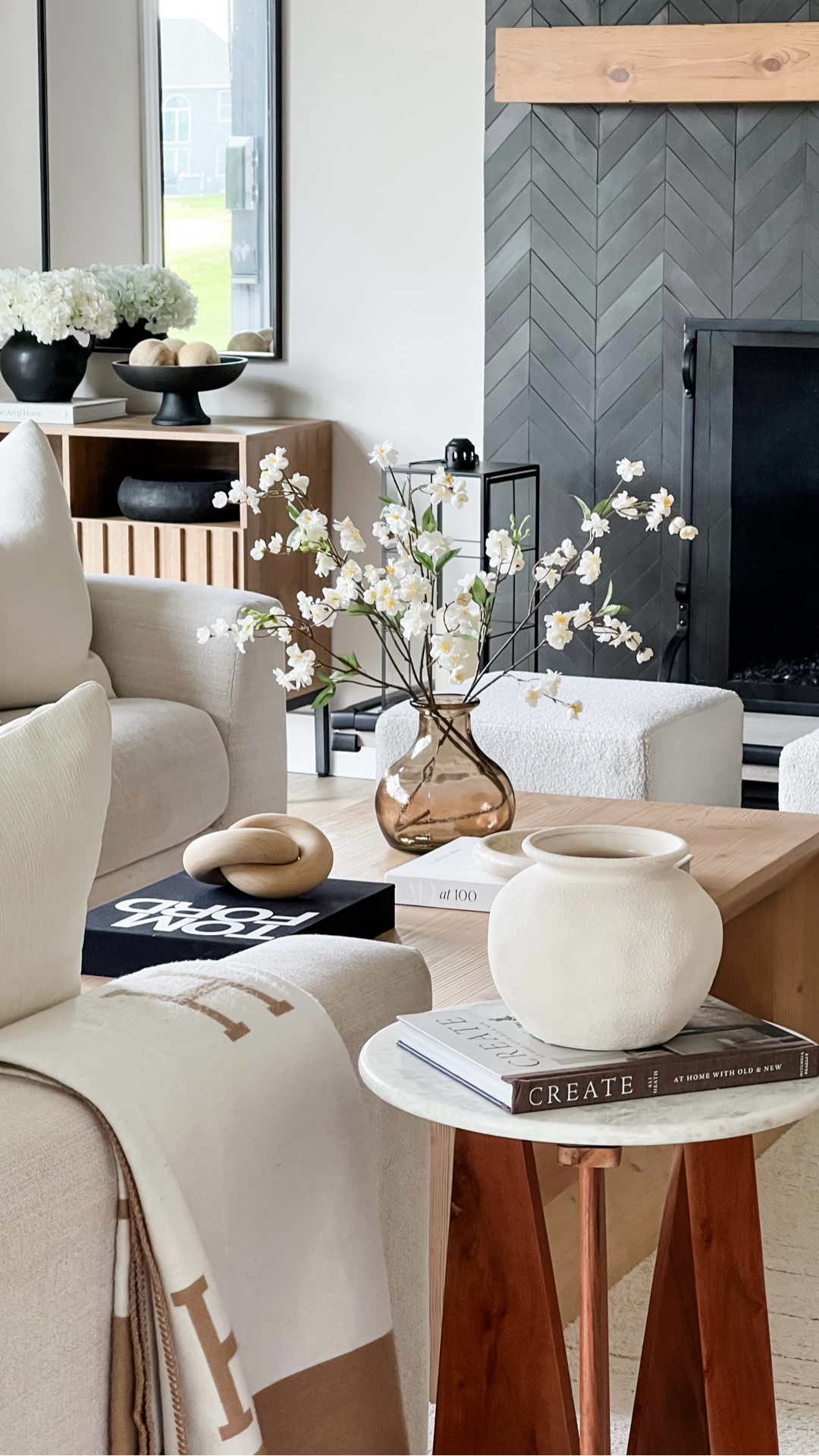 Spring coffee table styling 🤍
Warm woods, soft textures, and cherry blossoms on repeat lately.

#LTKHome #LTKSeasonal