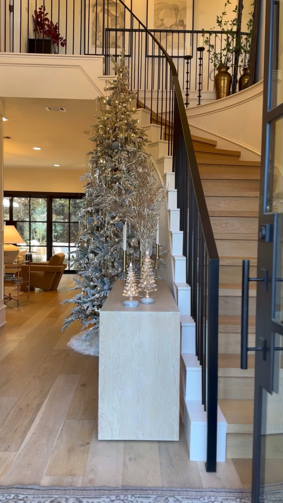 Holiday entryway views 🥰

flocked 10’ Christmas tree, gold stems, candelabra, console table, elevated holiday decor 

#LTKHome #LTKHoliday #LTKStyleTip