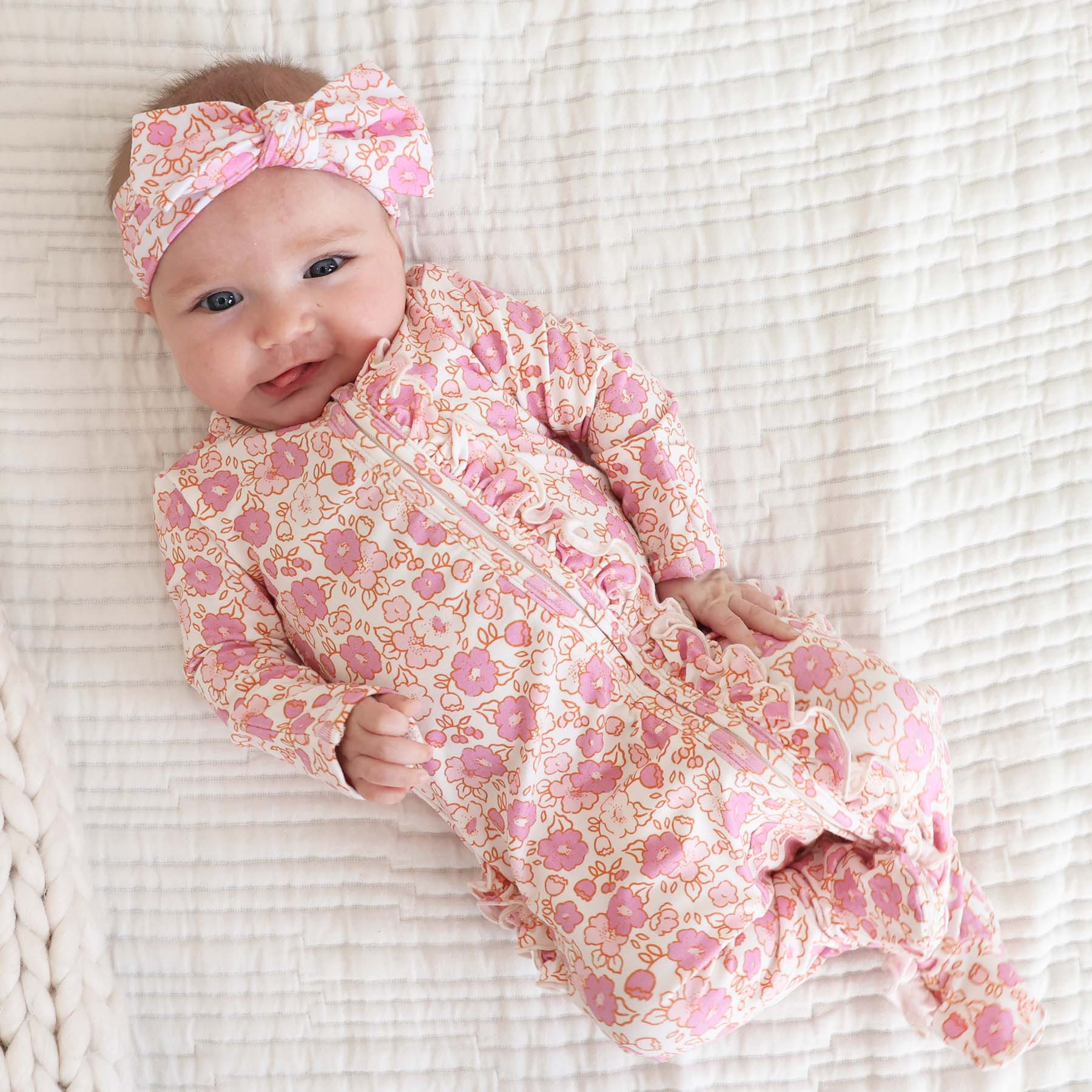 Palmer's Pink Floral Ruffle Zipper Footie | Caden Lane