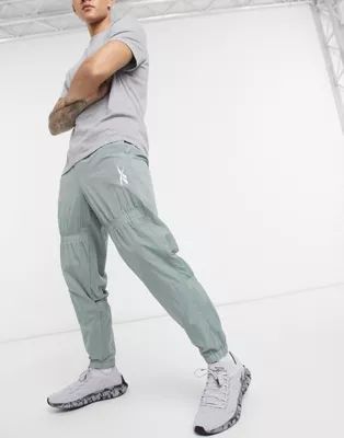 Reebok woven drawstring track pants in khaki | ASOS (Global)