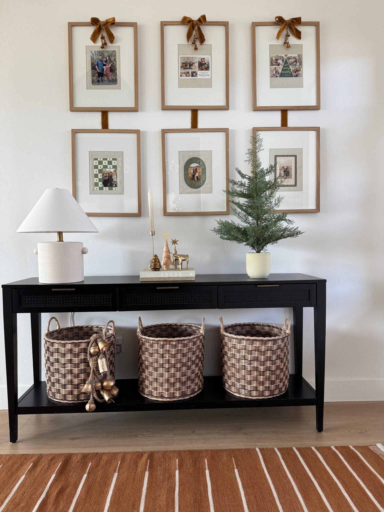 Display your Chrismtas cards from previous years in picture frames and complete with a little velvet bow! This is in my entryway and my new favorite holiday corner of our home!  Sadly my exact frames (and most everything in this picture) are no longer sold, but linked some other favorites! 

#LTKSeasonal #LTKHome #LTKHoliday