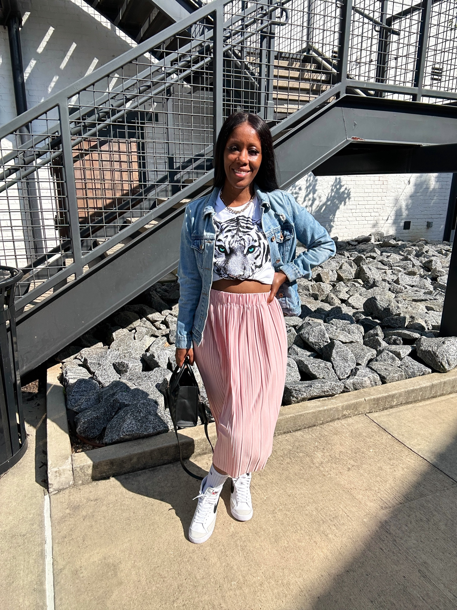 How to style a graphic tee from Walmart! I’m wearing a size small in the graphic tee, pleated midi skirt, and denim jacket. 