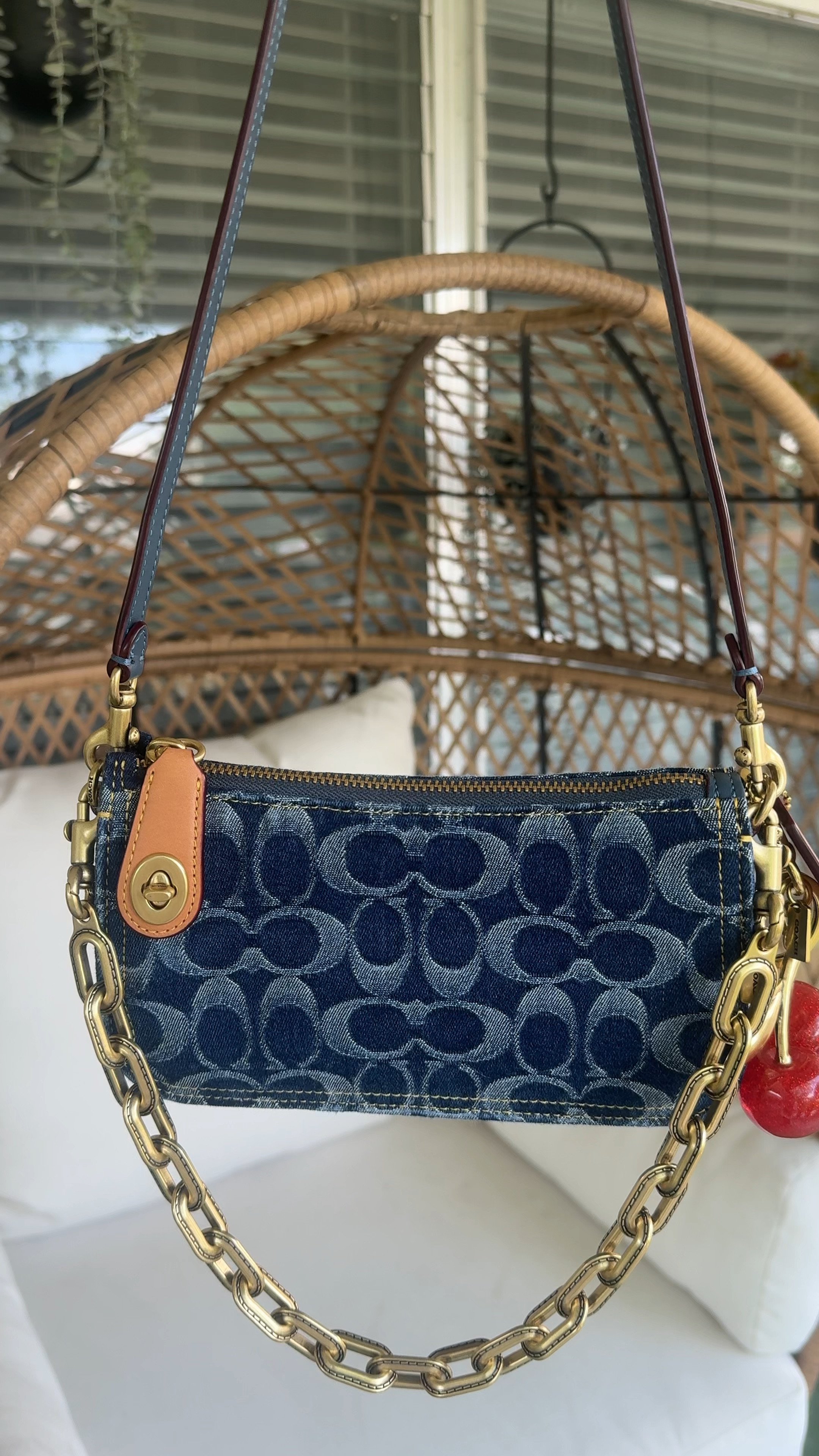 Coach Penn Should Bag in Denim paired with the Gold Link Chain Strap and Cherry Charm

#coach 