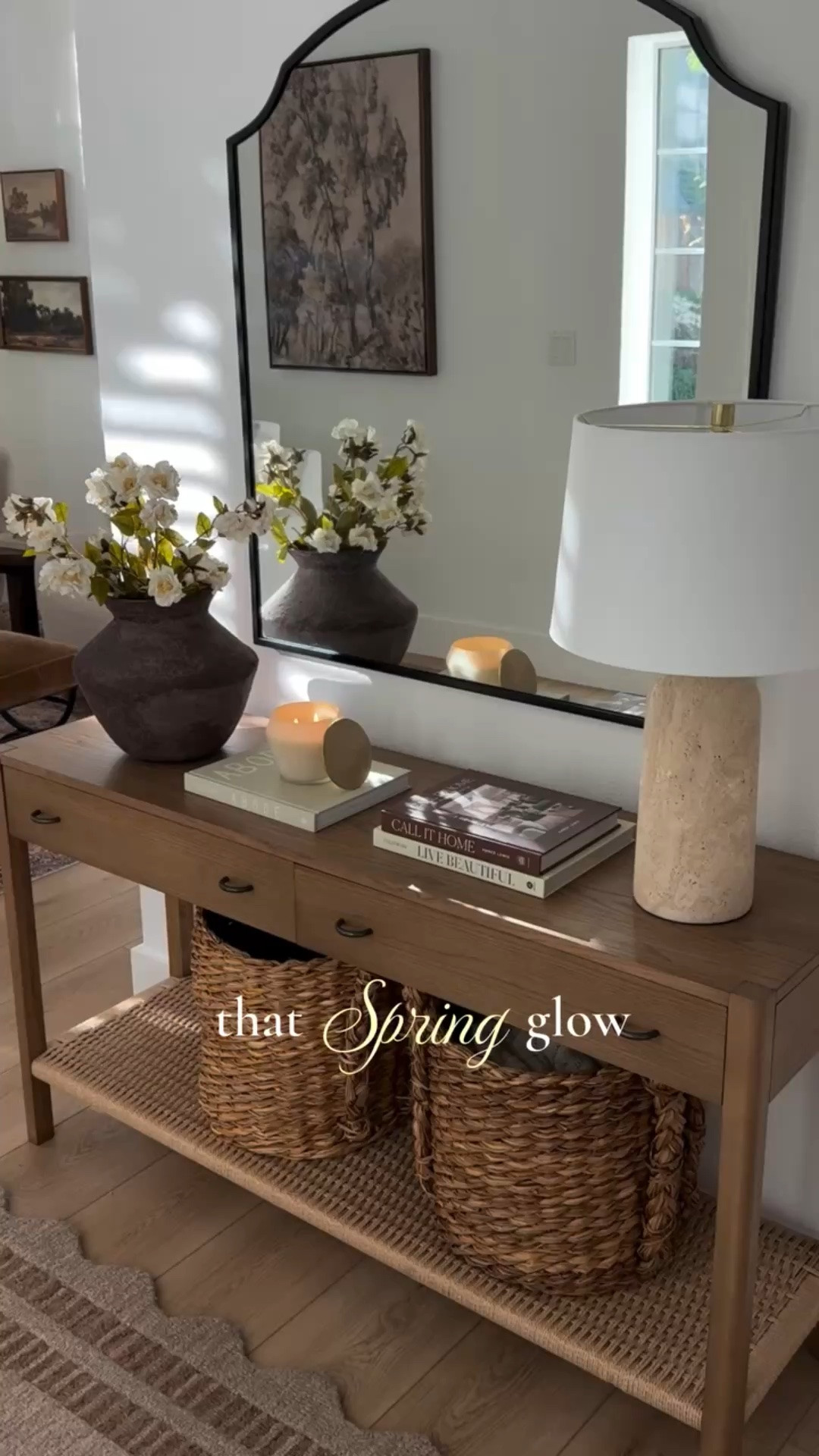 Entryway spring decor 🌼

Simple console table refresh with a new vase, fresh florals, and a few favorite books. Loving the sunlight reflection this time of year.

#LTKHome #LTKSeasonal #LTKU