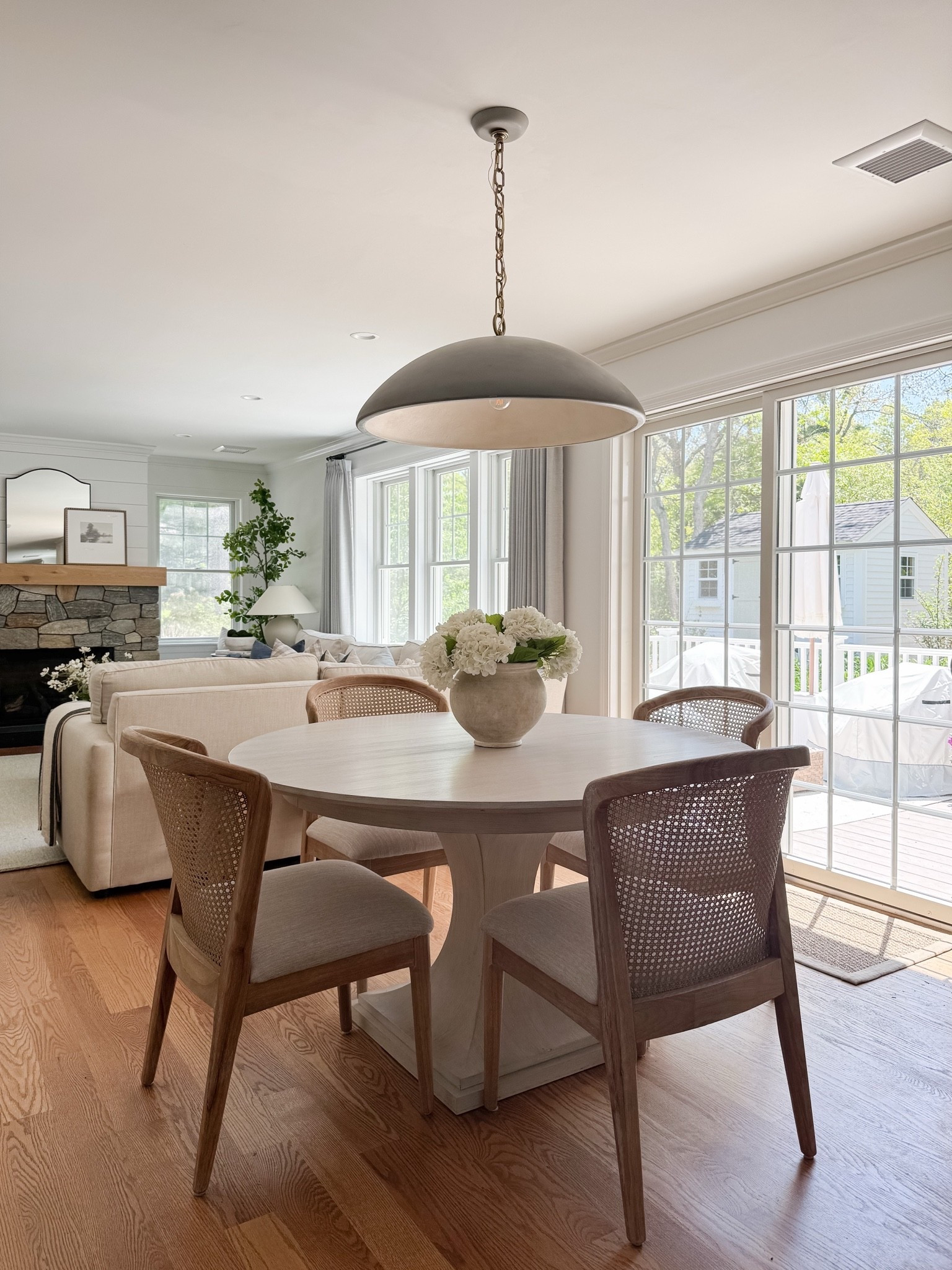 Coastal dining room styled with round wood table, woven dining chairs, faux hydrangeas, and soft natural light for relaxed coastal dining.

coastal dining room decor, round wood dining table, woven dining chairs, faux hydrangea centerpiece, neutral dining room styling, coastal interior decor, light coastal home, neutral dining room inspiration, sherricalnanhome

#LTKHome