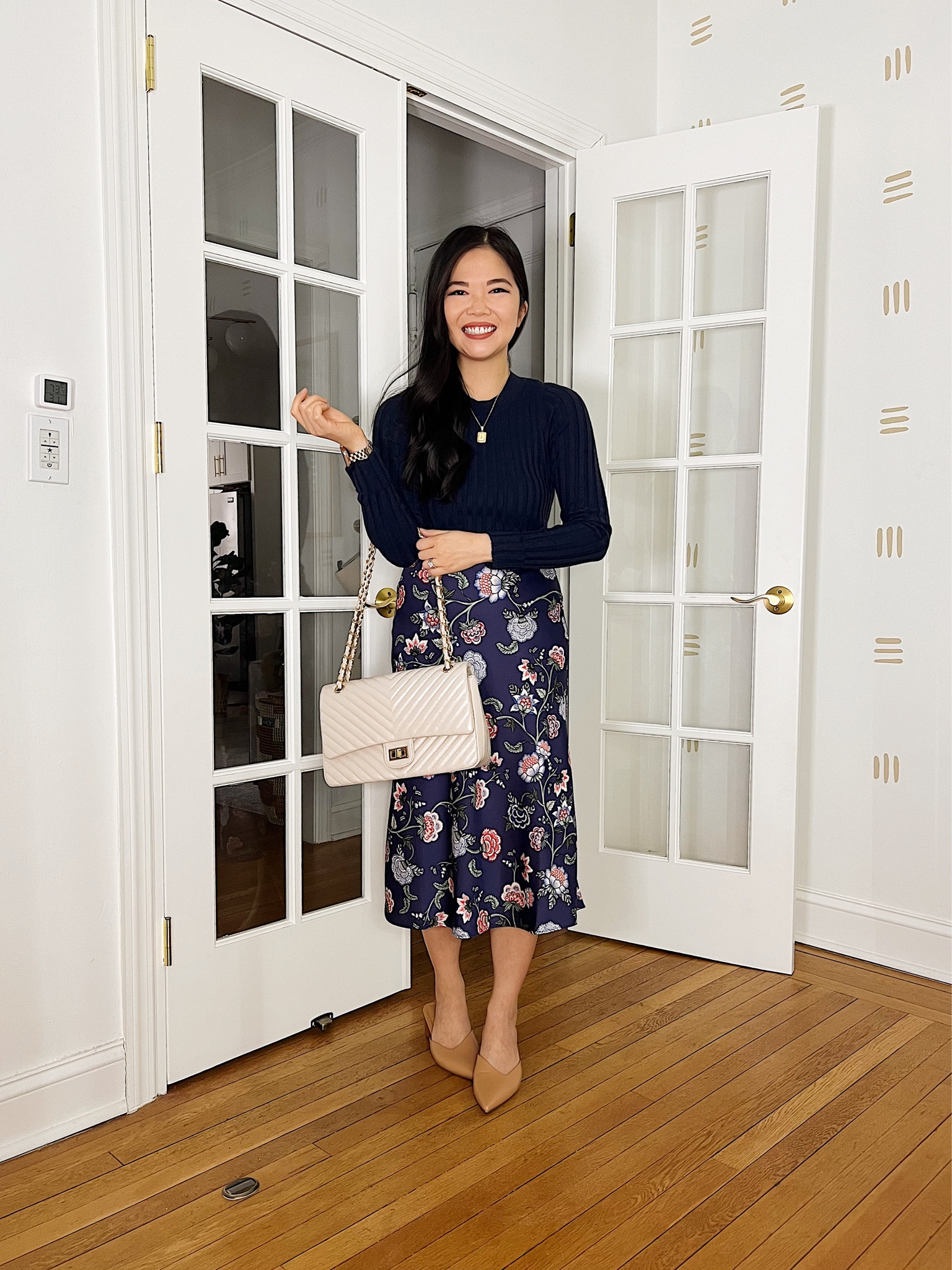 Navy long sleeve top (XS)
Navy floral skirt (XS)
Navy midi skirt
Floral midi skirt
Beige quilted bag
Cream quilted bag
Tan mule pumps (TTS)
Gold initial necklace
LOFT
Spring outfit
Spring work outfit

#LTKunder50 #LTKSeasonal #LTKFind
