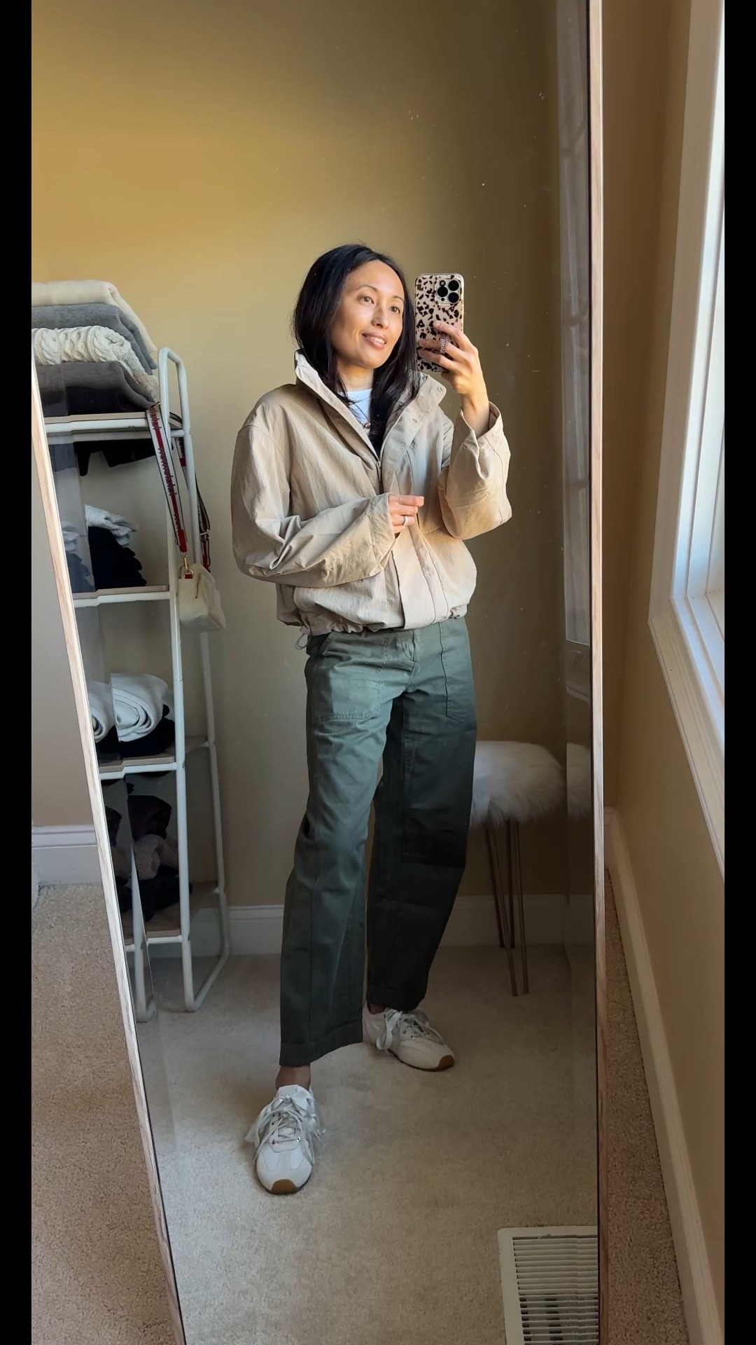 Spring jacket  Everyday casual Spring outfit. 
Timeless style with good basics: 
- khaki jacket 
- white t-shirt
- casual cotton pants 
- sneakers 
- crossbody bag
- everyday jewelry 

Exact items:
- jacket:  I love a funnel neck. This athleisure style has great details, seems good material/ quality, and has a hidden hood. I sized up here, but going to exchange for my true size. Perfect spring jacket and would be good for travel. 
- favorite white t-shirt: wearing a size up here but I also wear true to size. 
- olive pants: cute casual style that is a nice change up from jeans or black athleisure bottoms. Size down. 
- crossbody bag: the strap makes the bag with the perfect pop of red against neutral stripes. Perfect for everyday essentials or as a travel bag. 
- white sneakers: trending slim profile ballerina style. 
- everyday gold jewelry with a hint of color. 


#LTKOver40 #LTKActive #LTKTravel