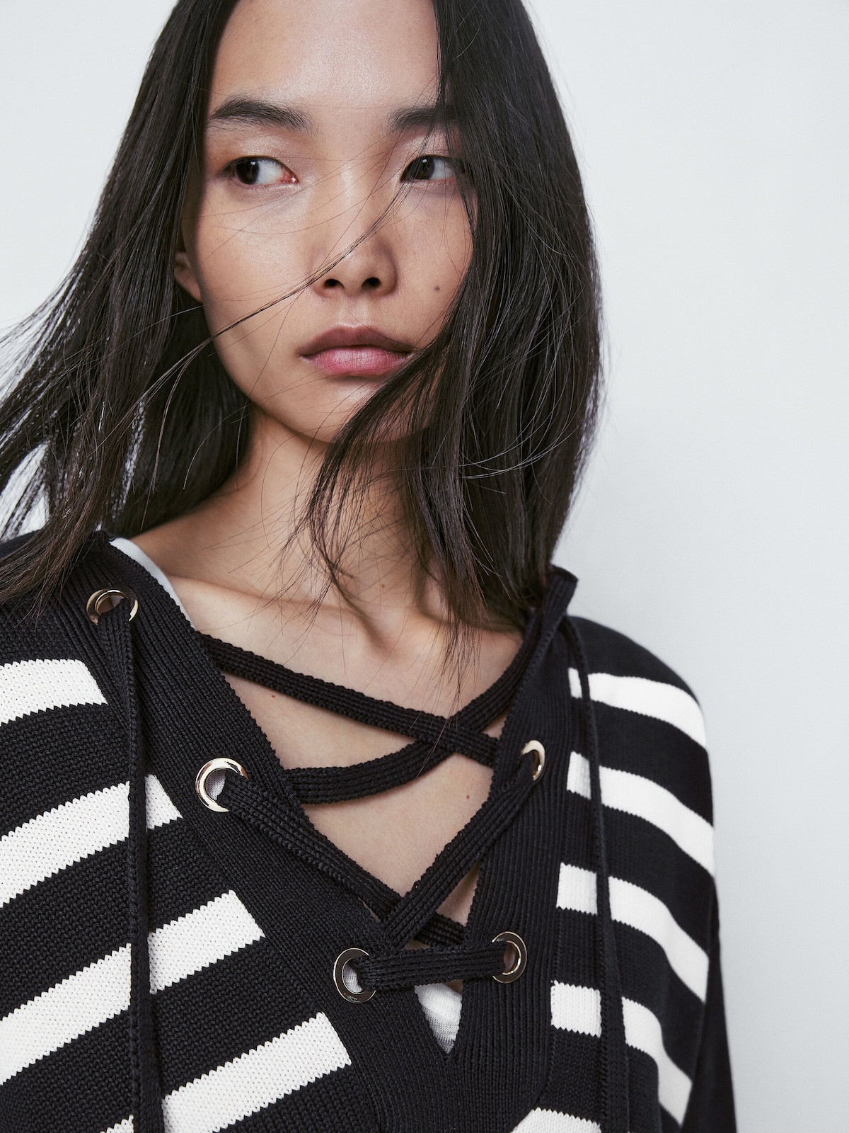 Striped knit sweater with a lace-up neckline | Massimo Dutti US