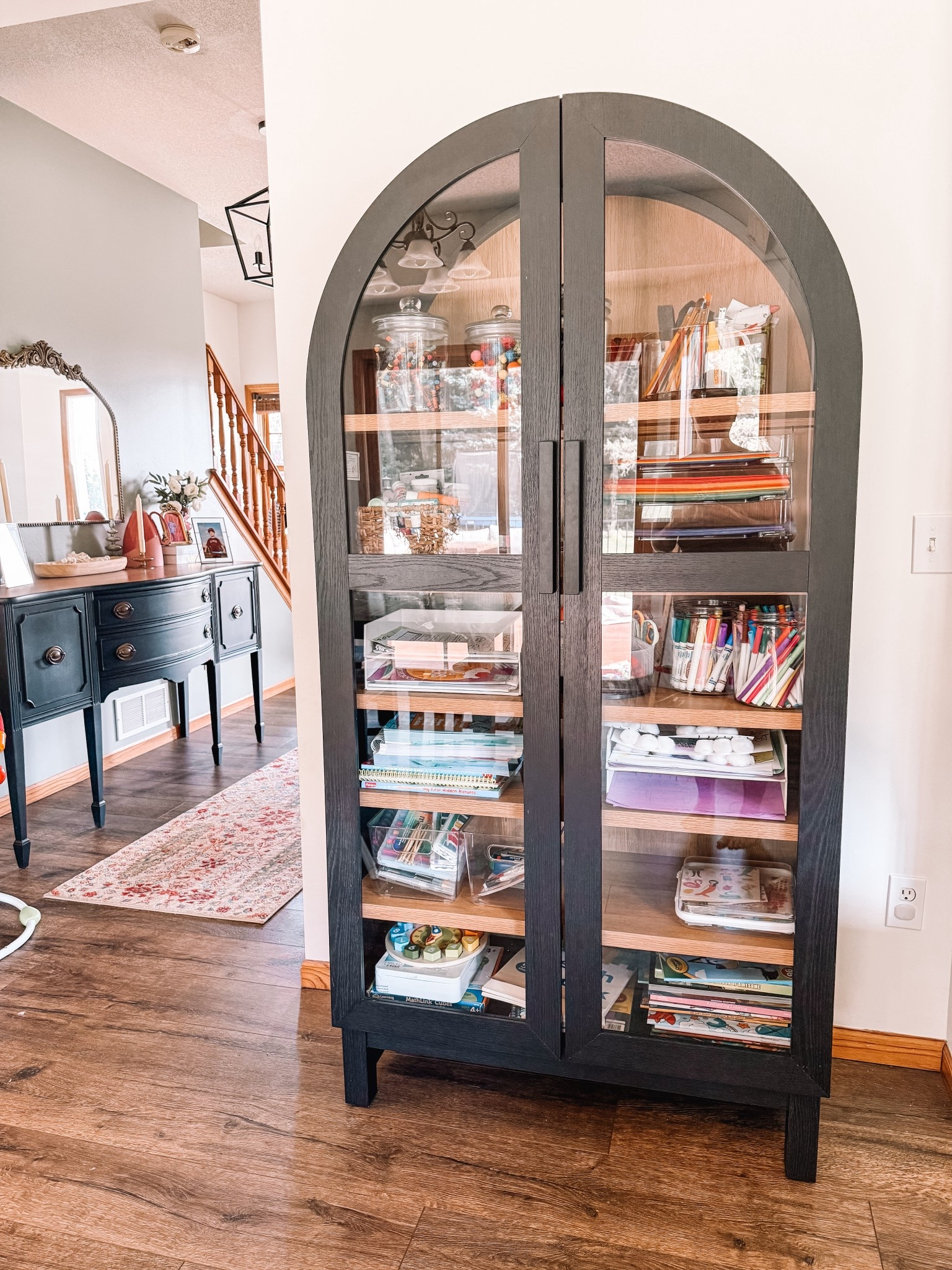 Arched cabinet on sale! A Walmart find that holds all our arts & crafts + homeschooling stuff.

Art cabinet
Craft organization 
Storage cabinet 

#LTKSaleAlert #LTKHome