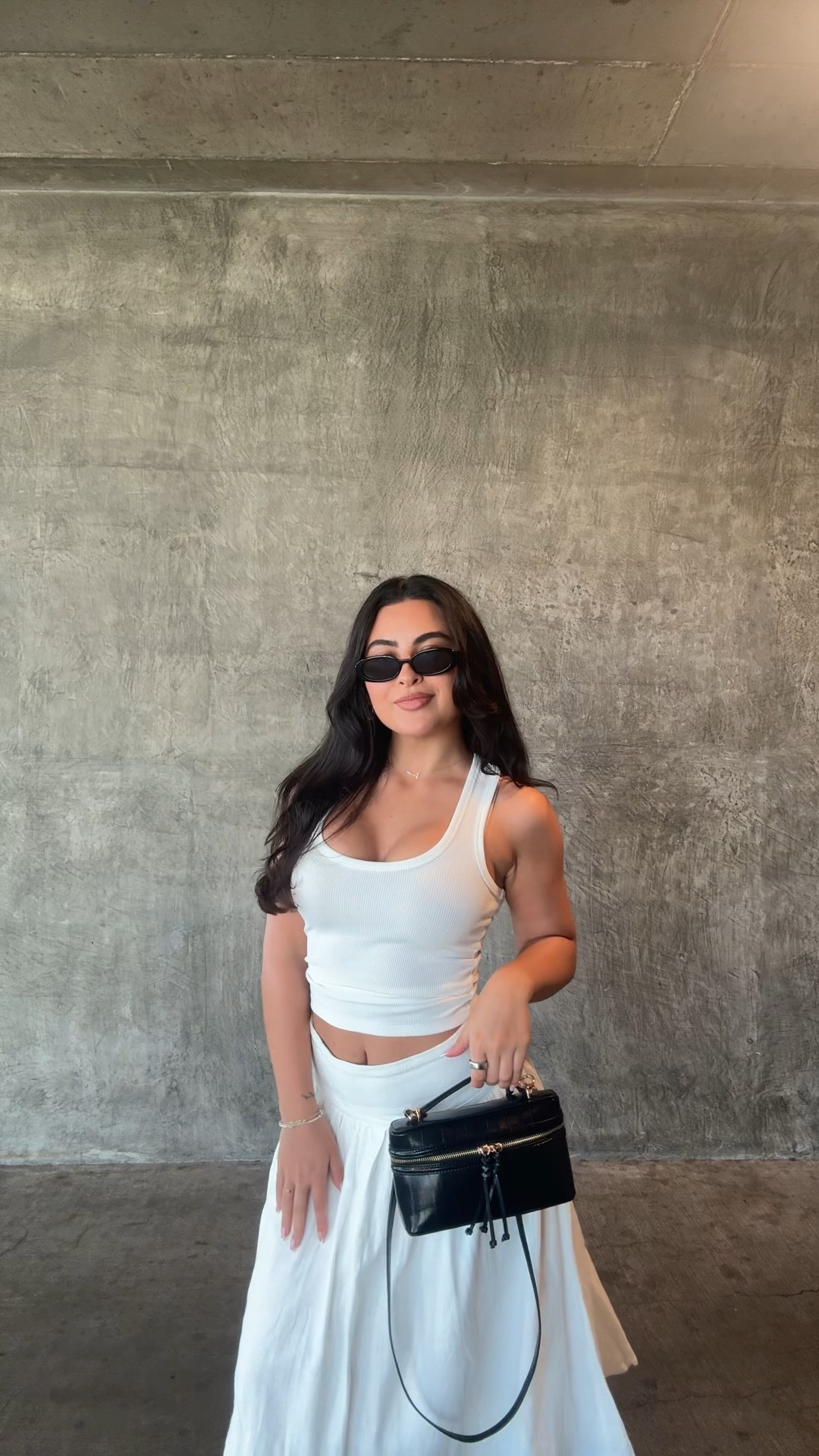 size XS in tank top thirtyears brand linked similar skims tank tops I love too!
size 2 in skirt 
le specs sunglasses 
H&M purse
Thrifted boots 