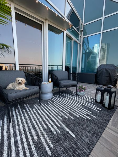 Outdoor balcony space. Outdoor rug & Chair set are from Target. Lanterns are from Walmart. 