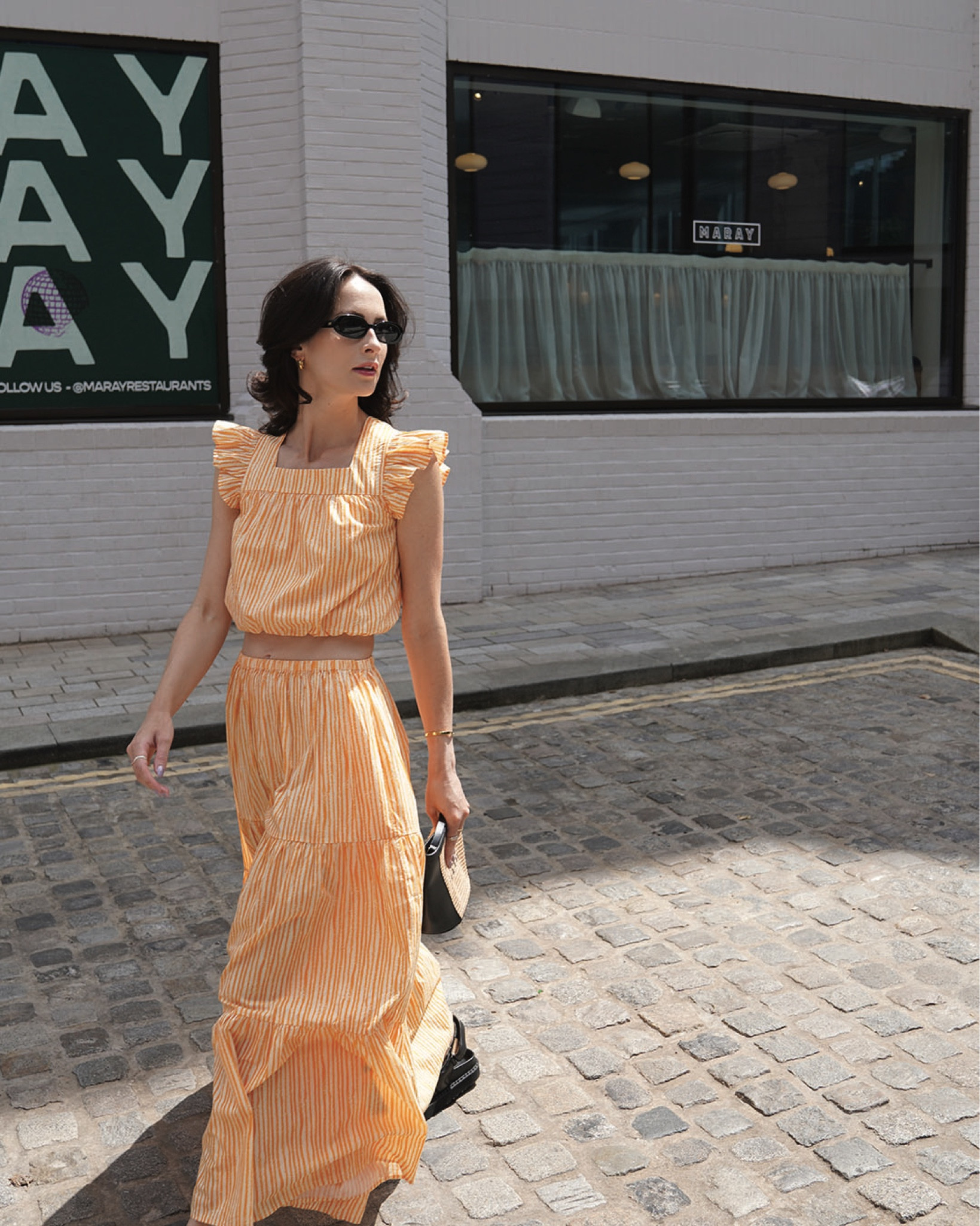 orange matching separates by whistles 
sunglasses by le specs
bag by marni via net a porter 
sandals by isabel marant via matches fashion 
silver earrings by astrid & miyu 

#LTKstyletip #LTKeurope #LTKSeasonal