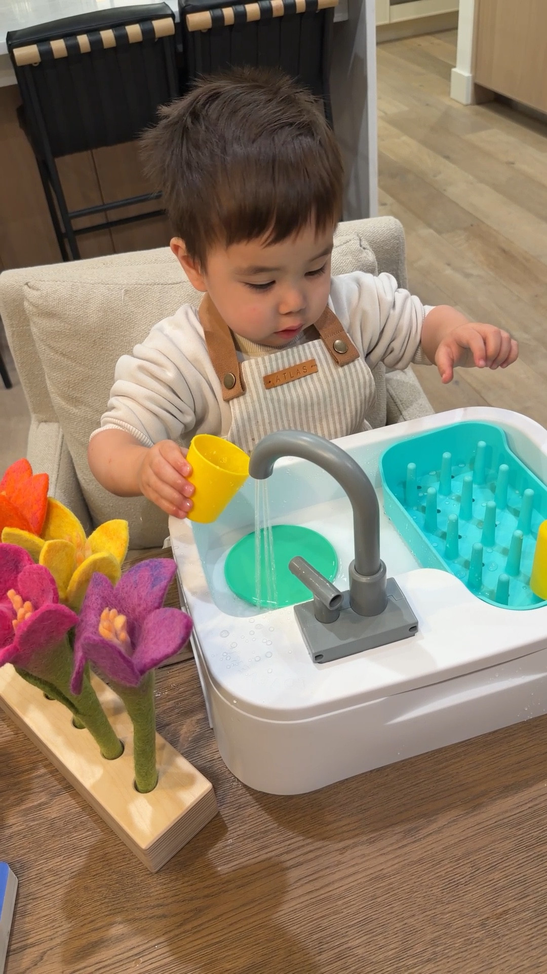 Best toddler toy ever!!

He sat here for 1.5 hours playing by himself 
I put a towel down 